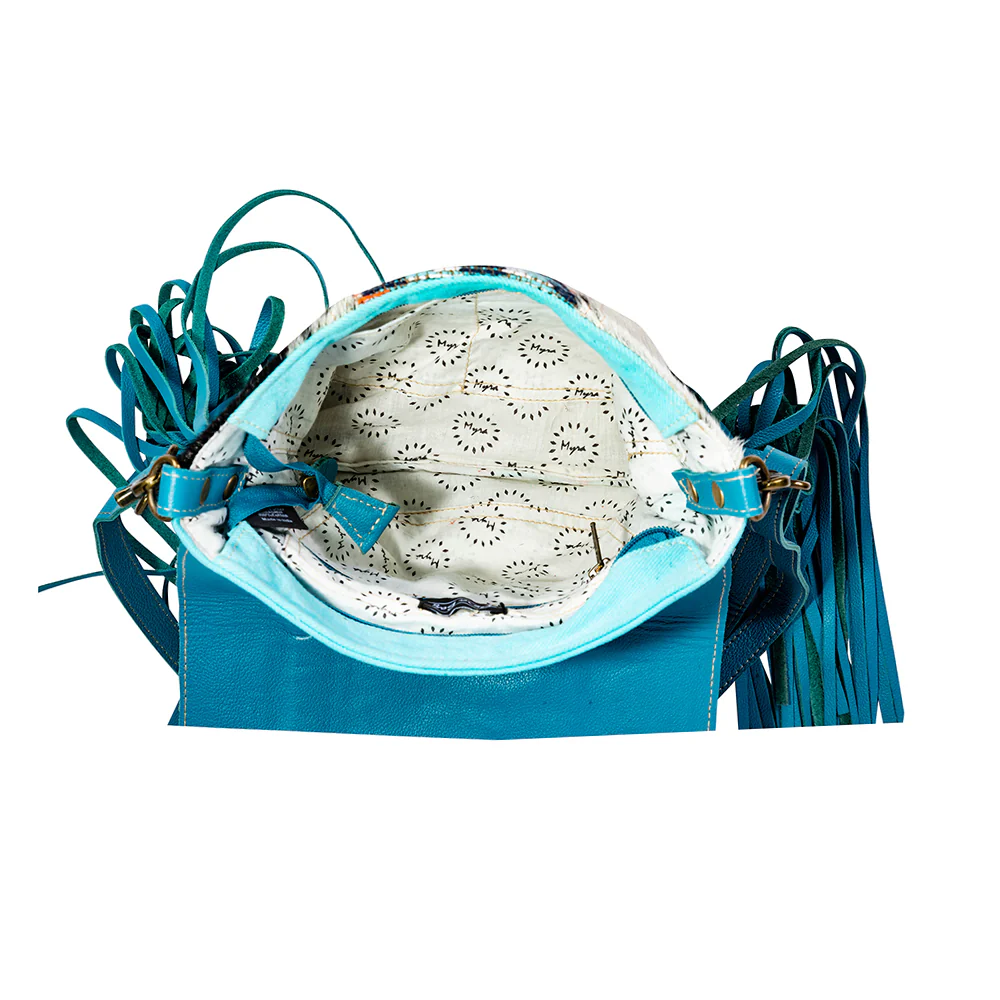 13314-tonga-ridge-canvas-hairon-bag-in-blue-1.webp