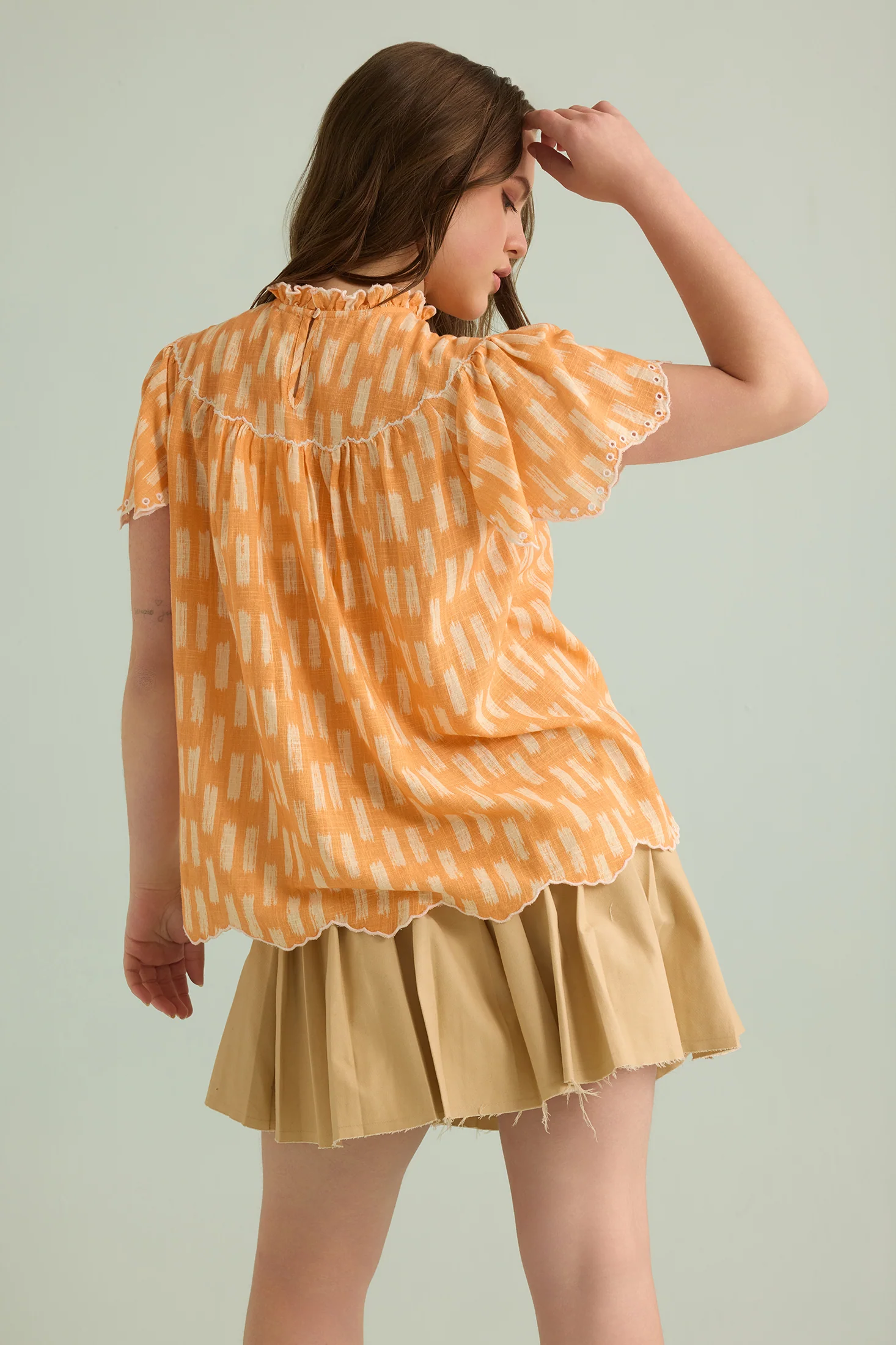 2453-callista-charm-top-in-orange-1.webp
