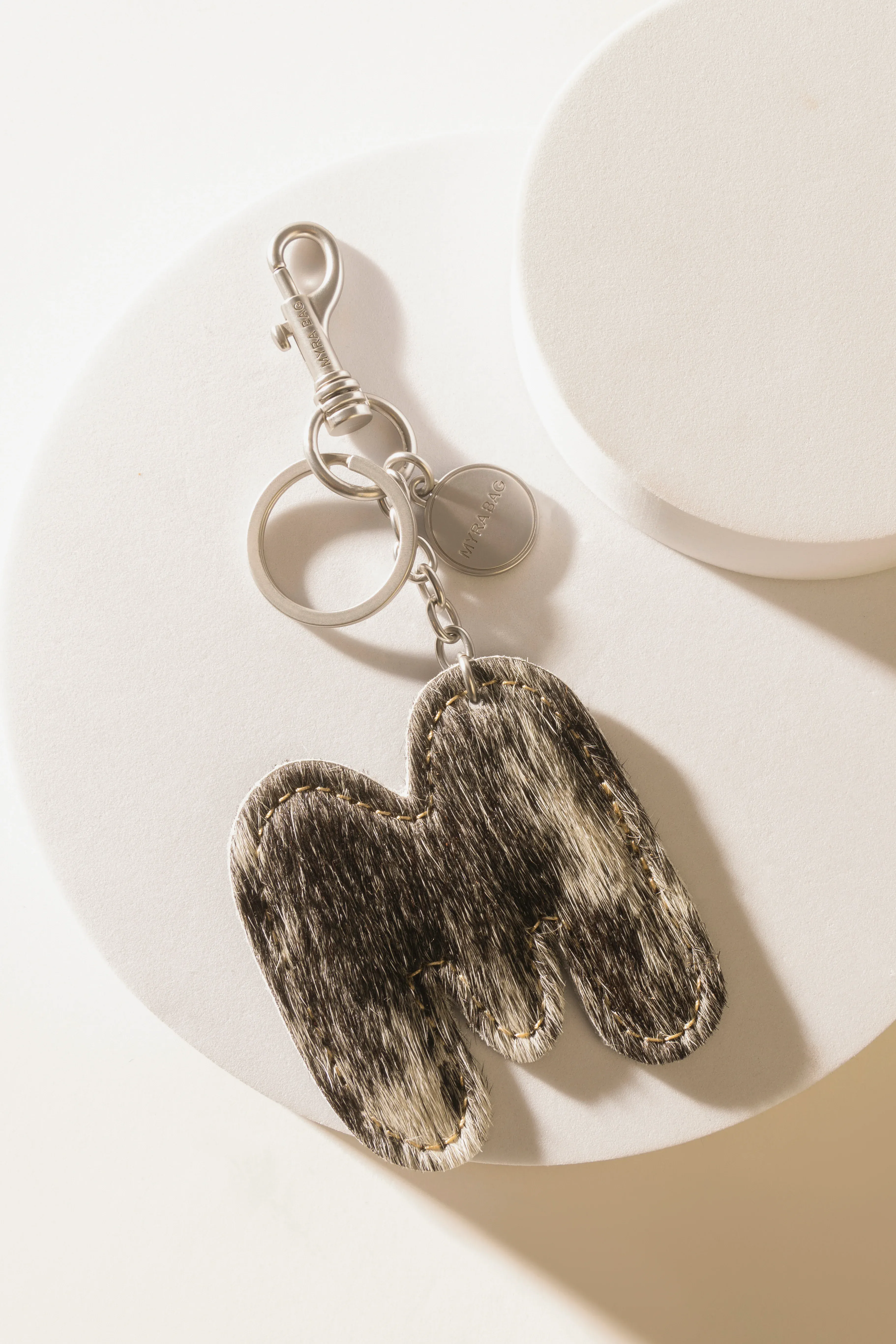 337-alpha-hairon-bag-charm-in-black-white-1.webp