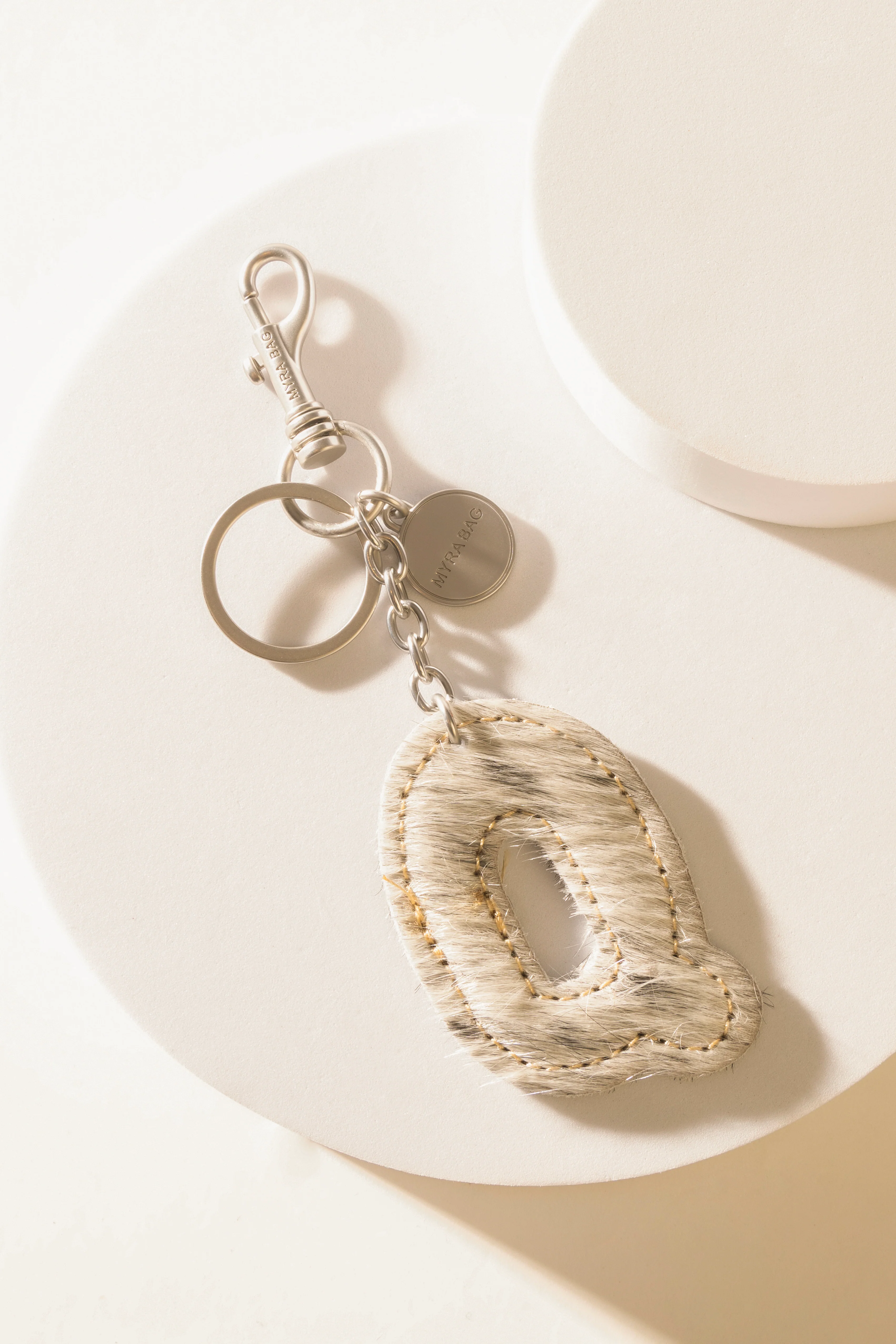 337-alpha-hairon-bag-charm-in-black-white-1.webp