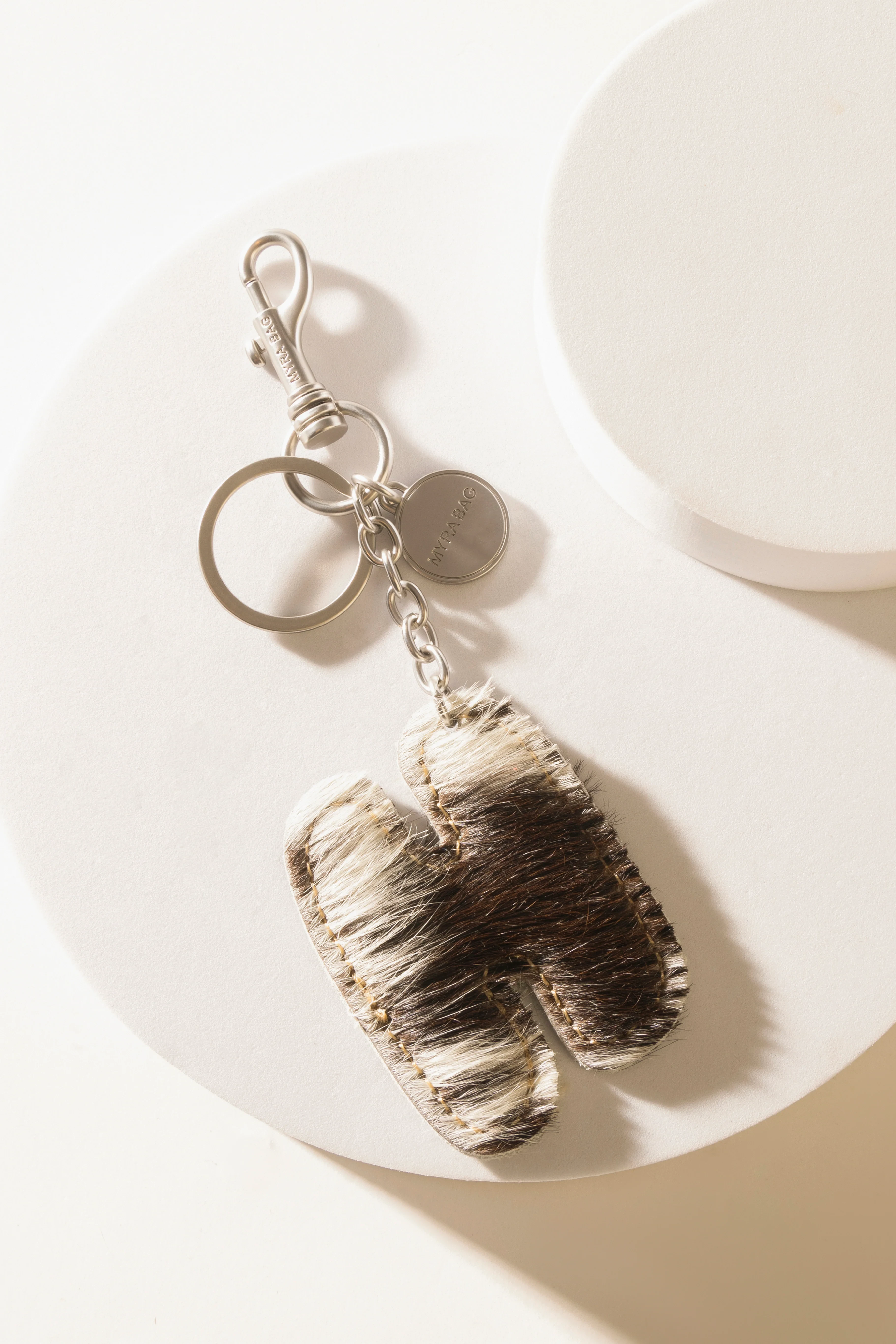 337-alpha-hairon-bag-charm-in-black-white-1.webp