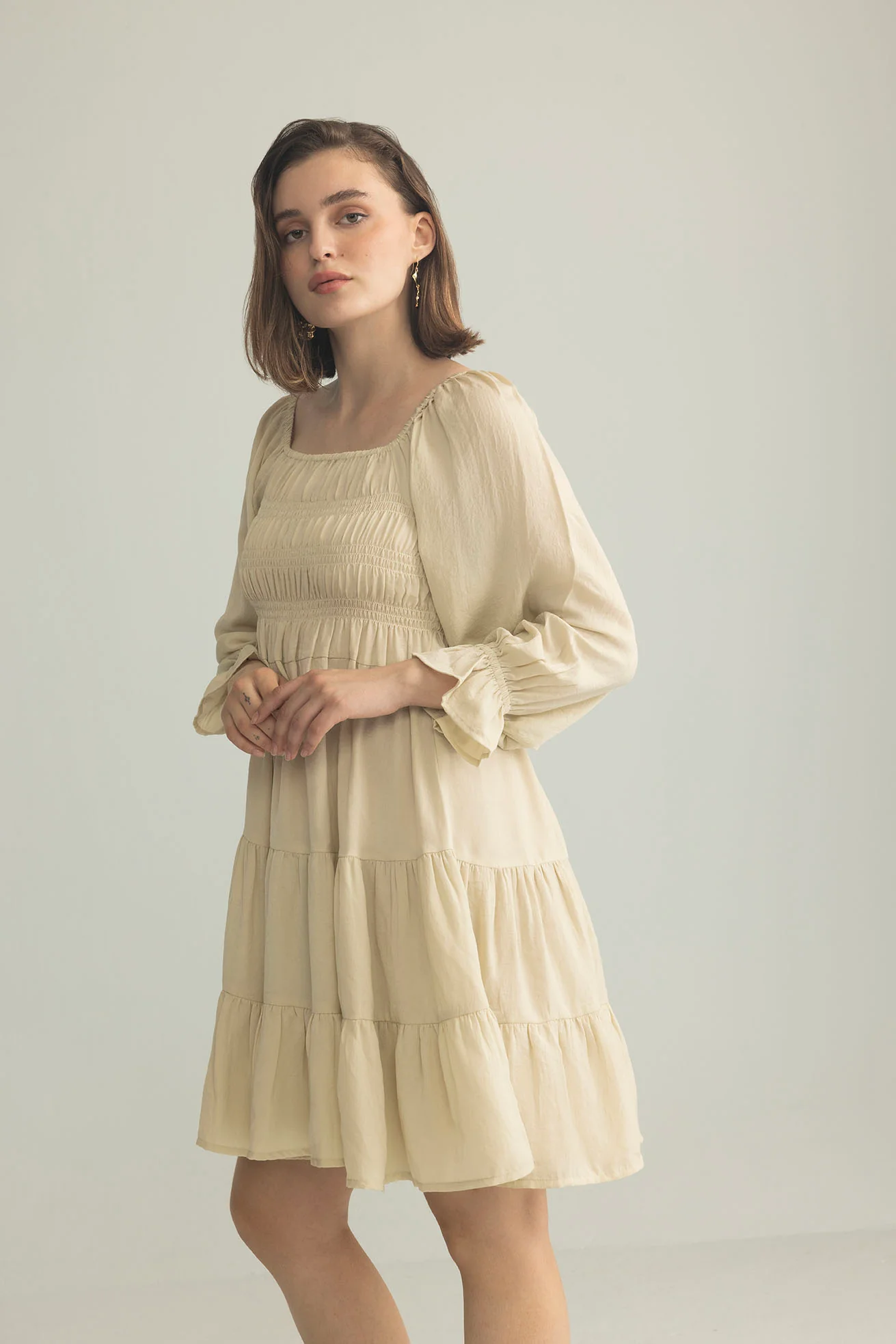 3548-daisywood-ruffle-smocking-dress-in-oatmeal-1.webp