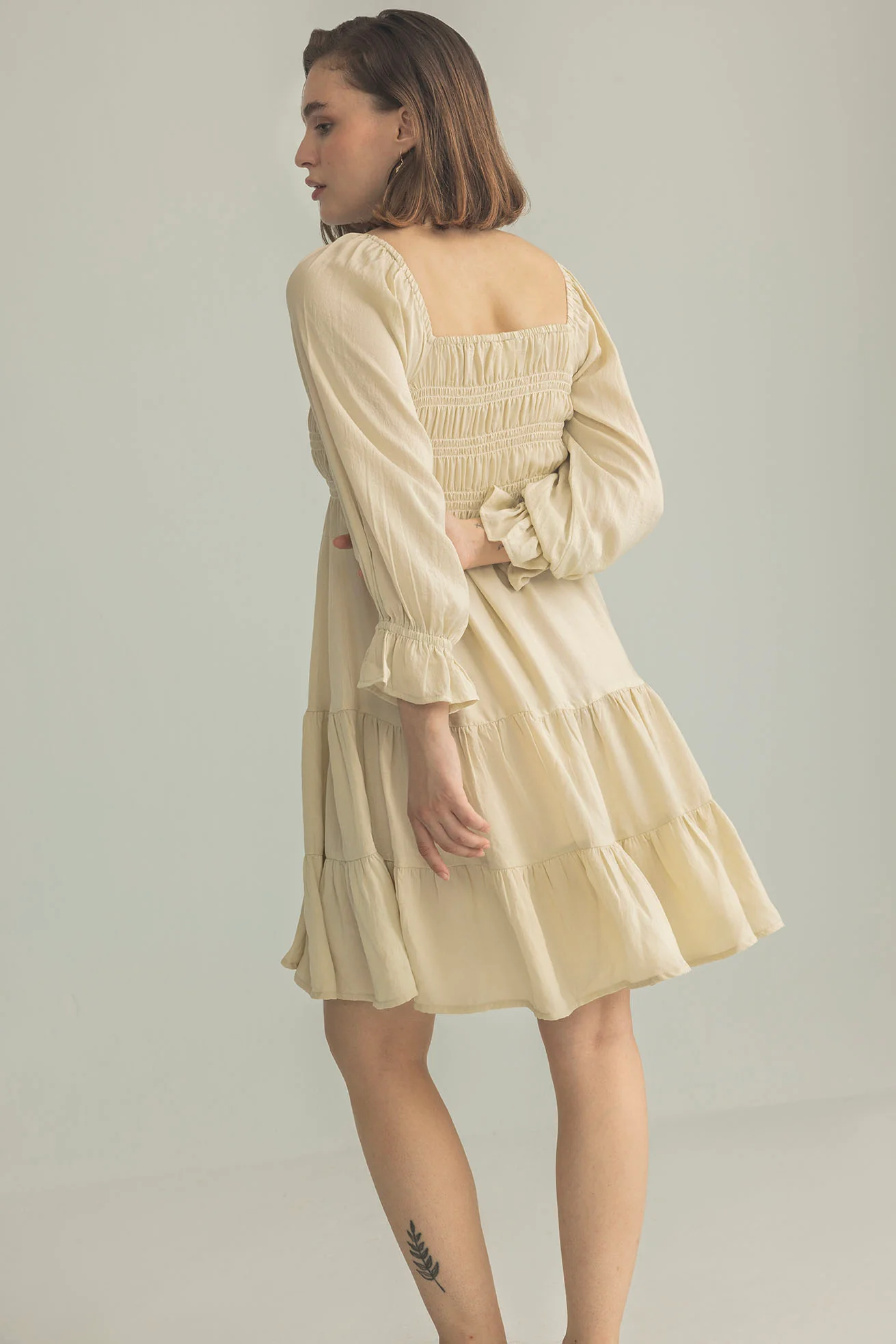3548-daisywood-ruffle-smocking-dress-in-oatmeal-1.webp