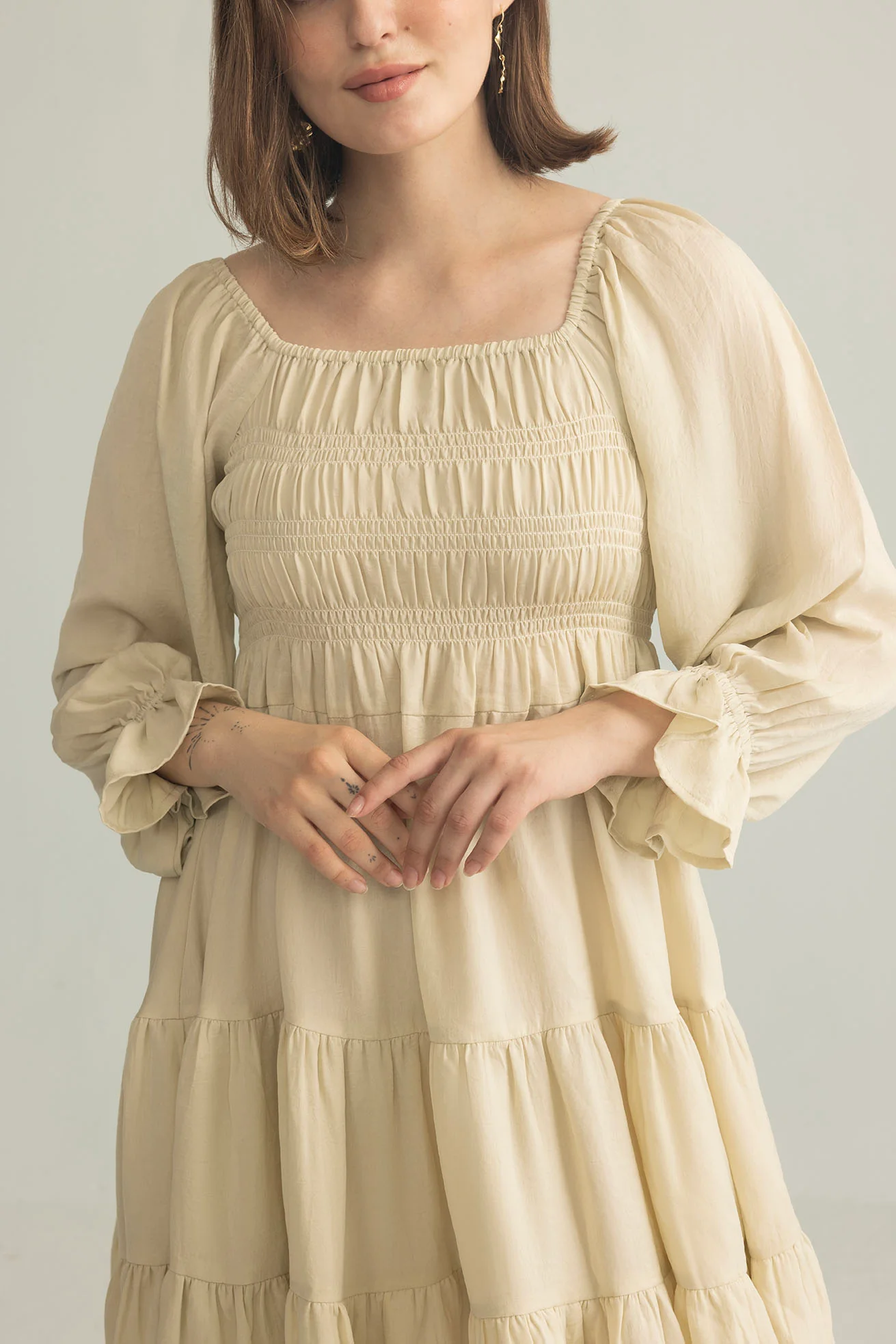 3548-daisywood-ruffle-smocking-dress-in-oatmeal-1.webp