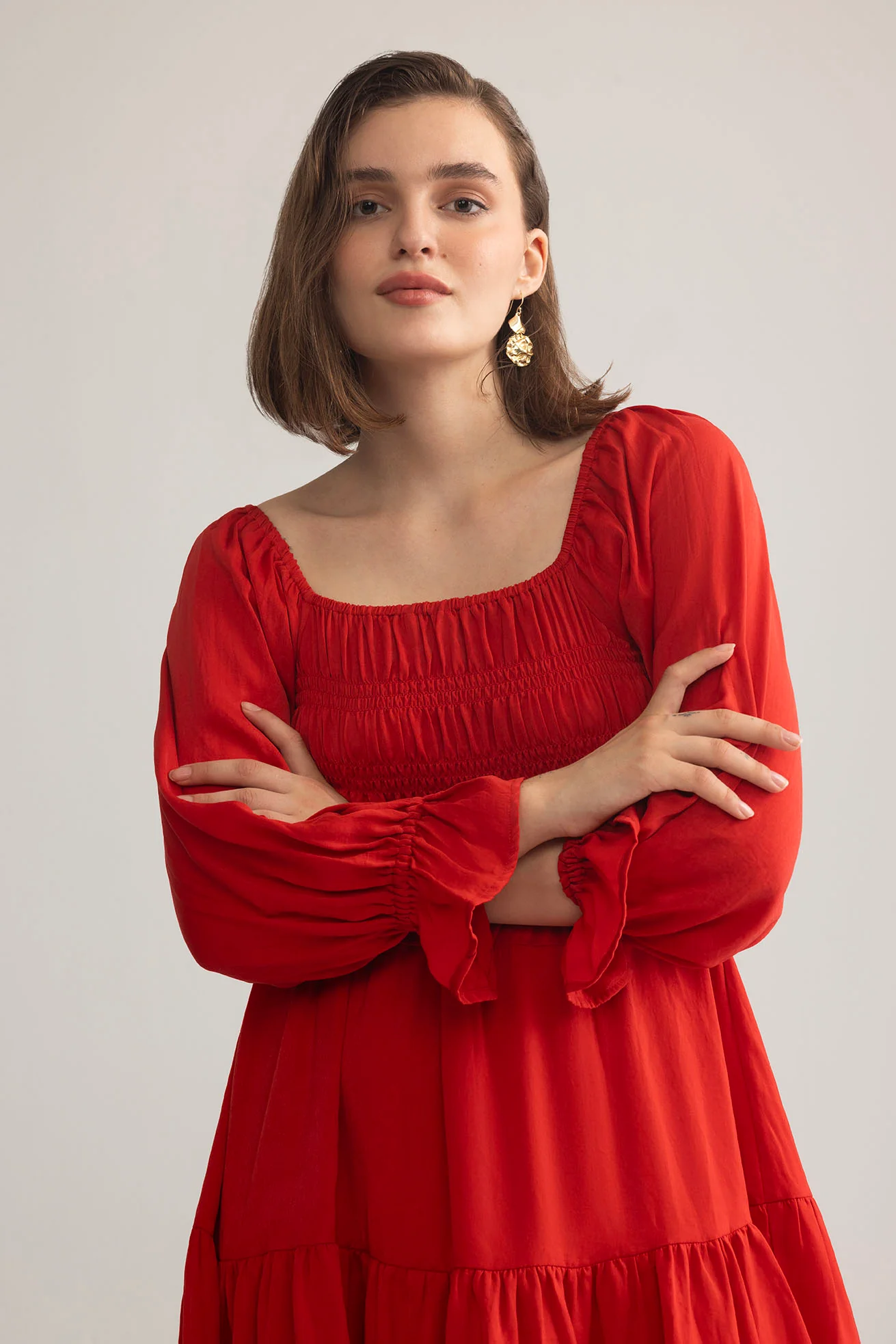 3555-daisywood-ruffle-smocking-dress-in-red-1.webp