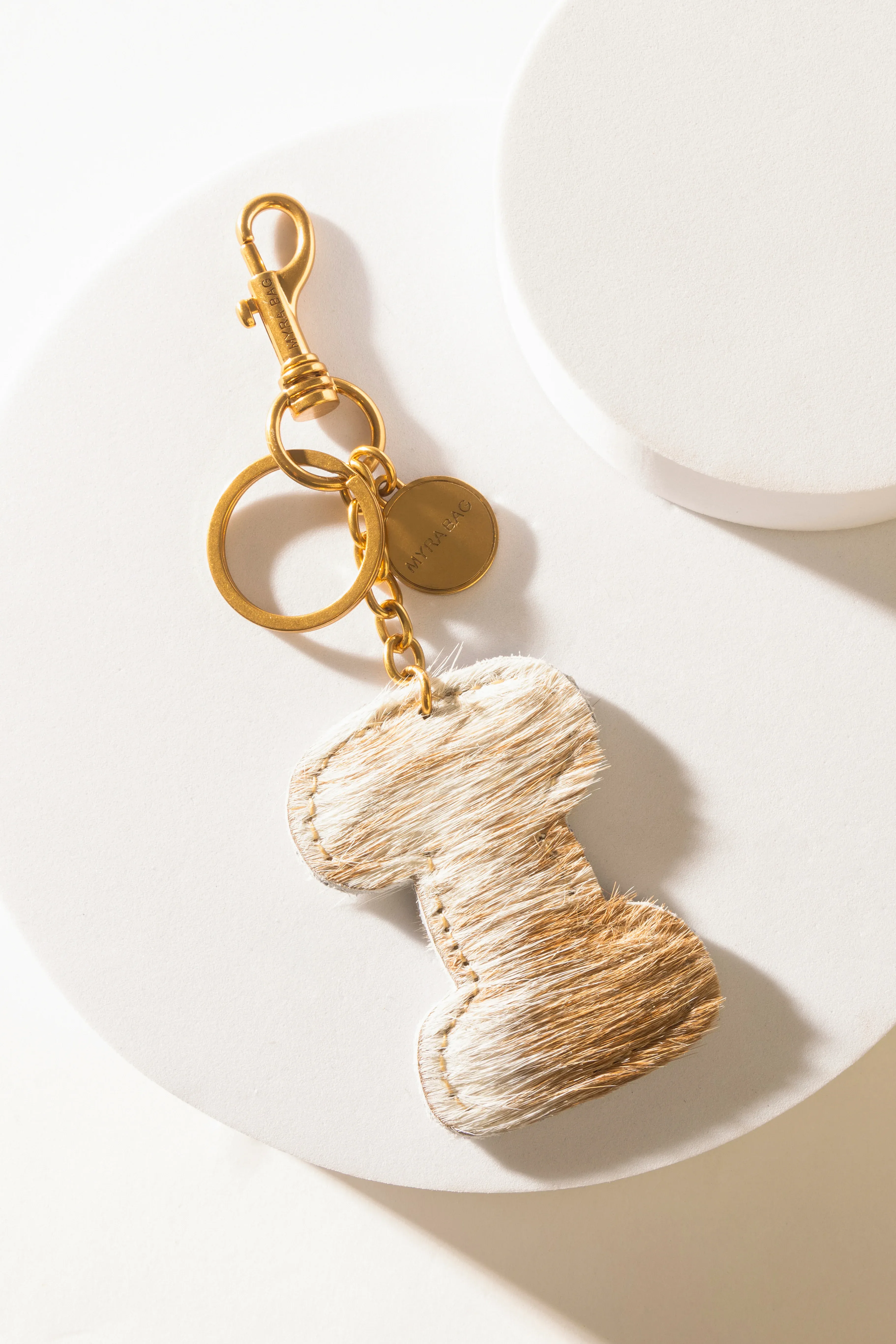 364-alpha-hairon-bag-charm-in-brown-white-1.webp