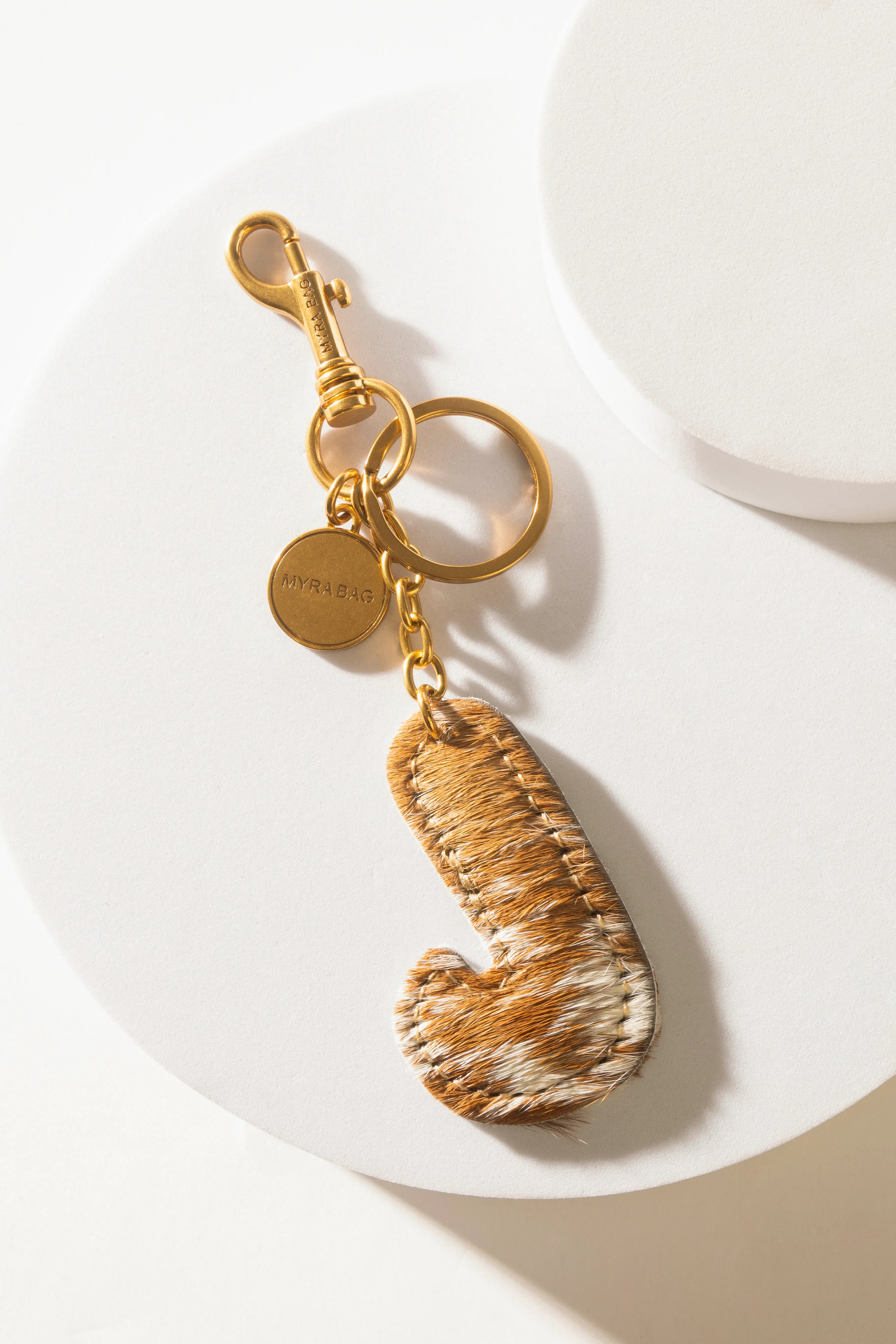 364-alpha-hairon-bag-charm-in-brown-white-1.webp