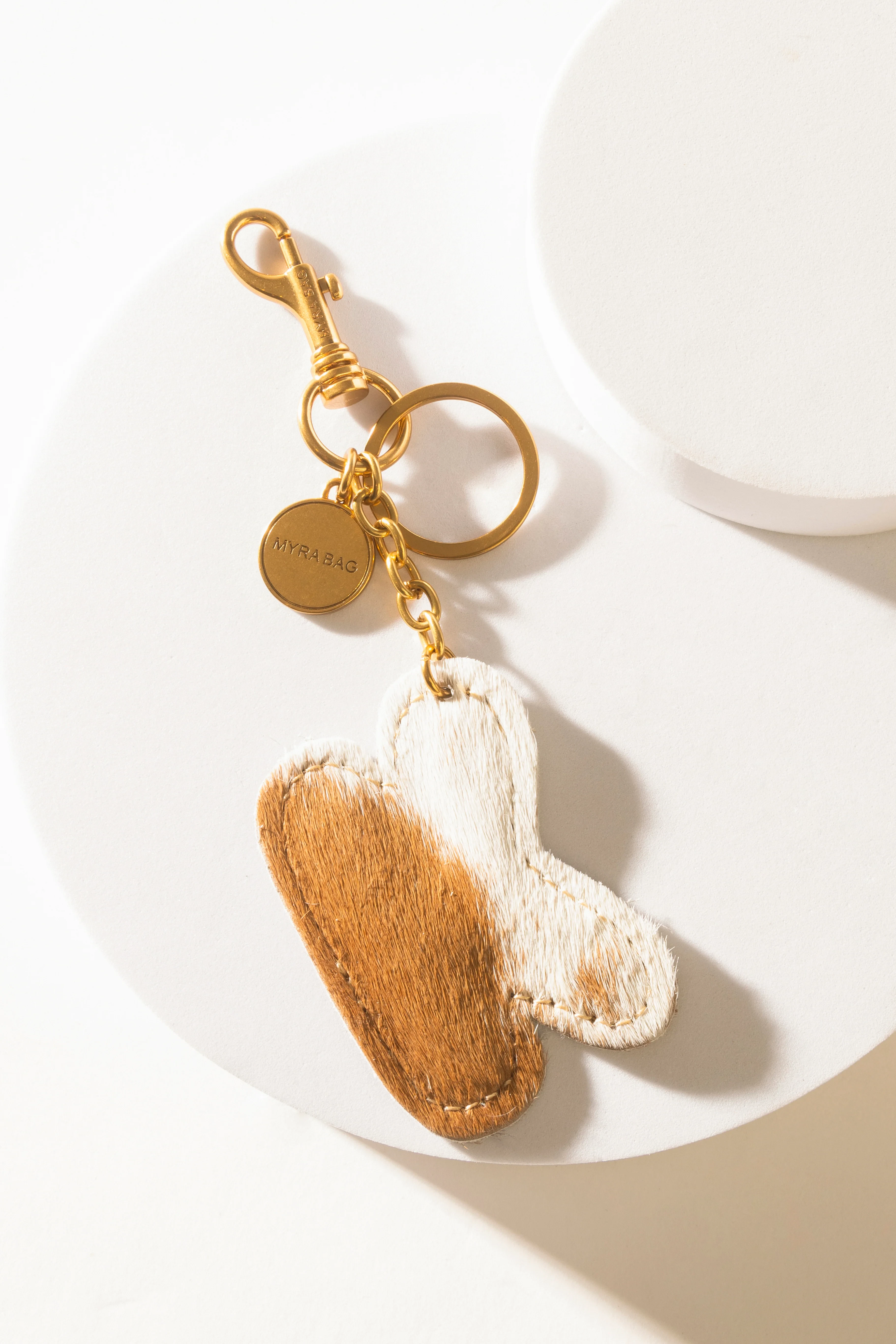 364-alpha-hairon-bag-charm-in-brown-white-1.webp