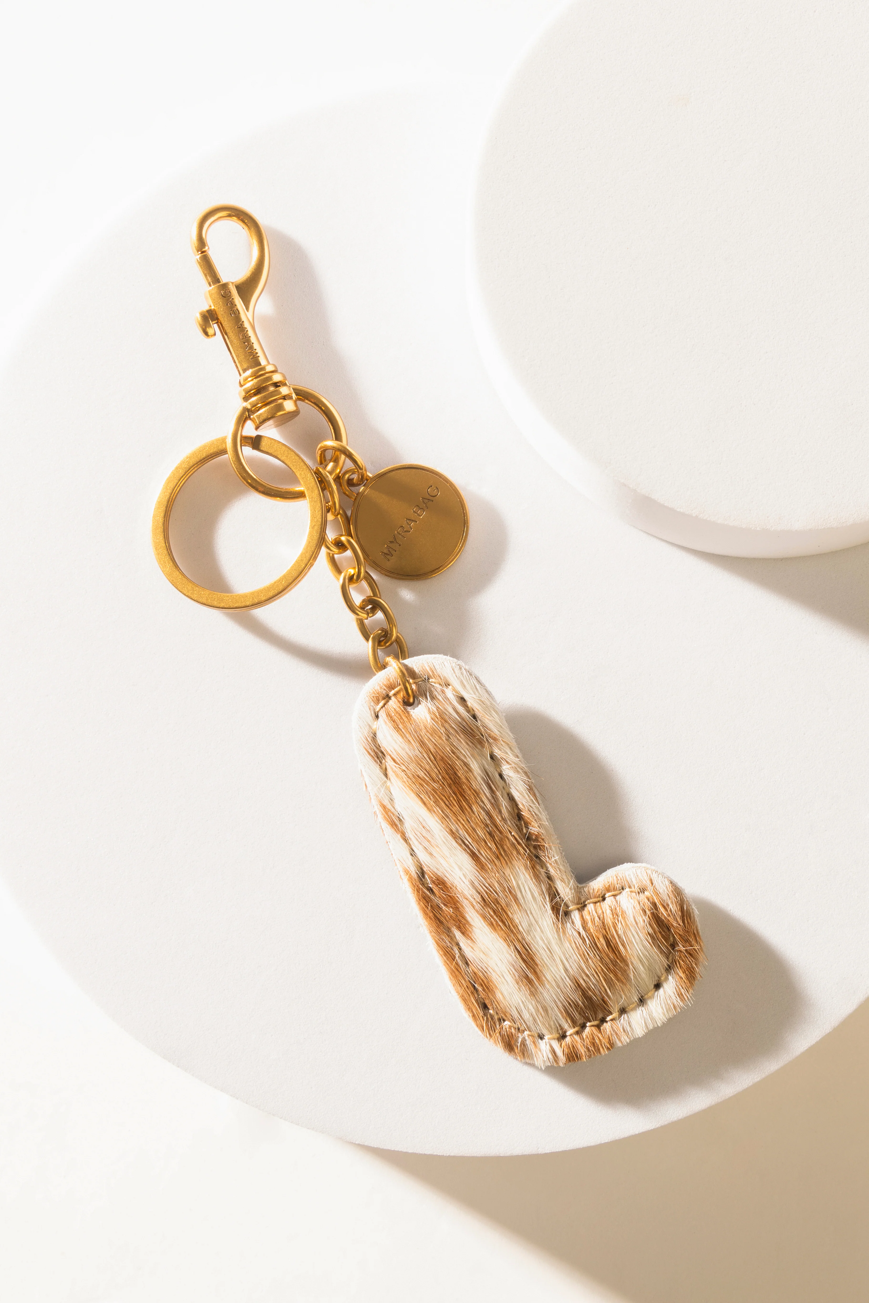 364-alpha-hairon-bag-charm-in-brown-white-1.webp