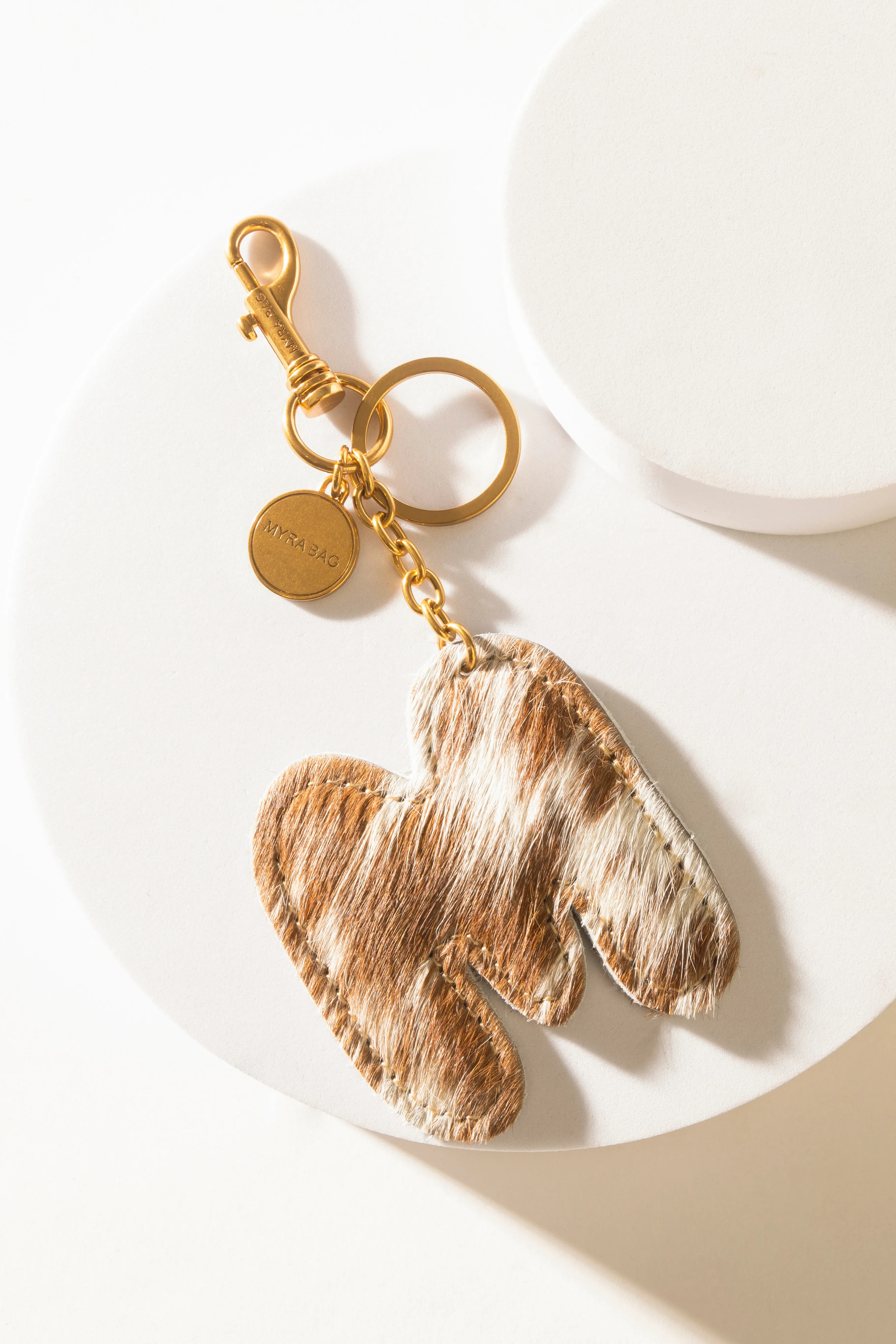 364-alpha-hairon-bag-charm-in-brown-white-1.webp