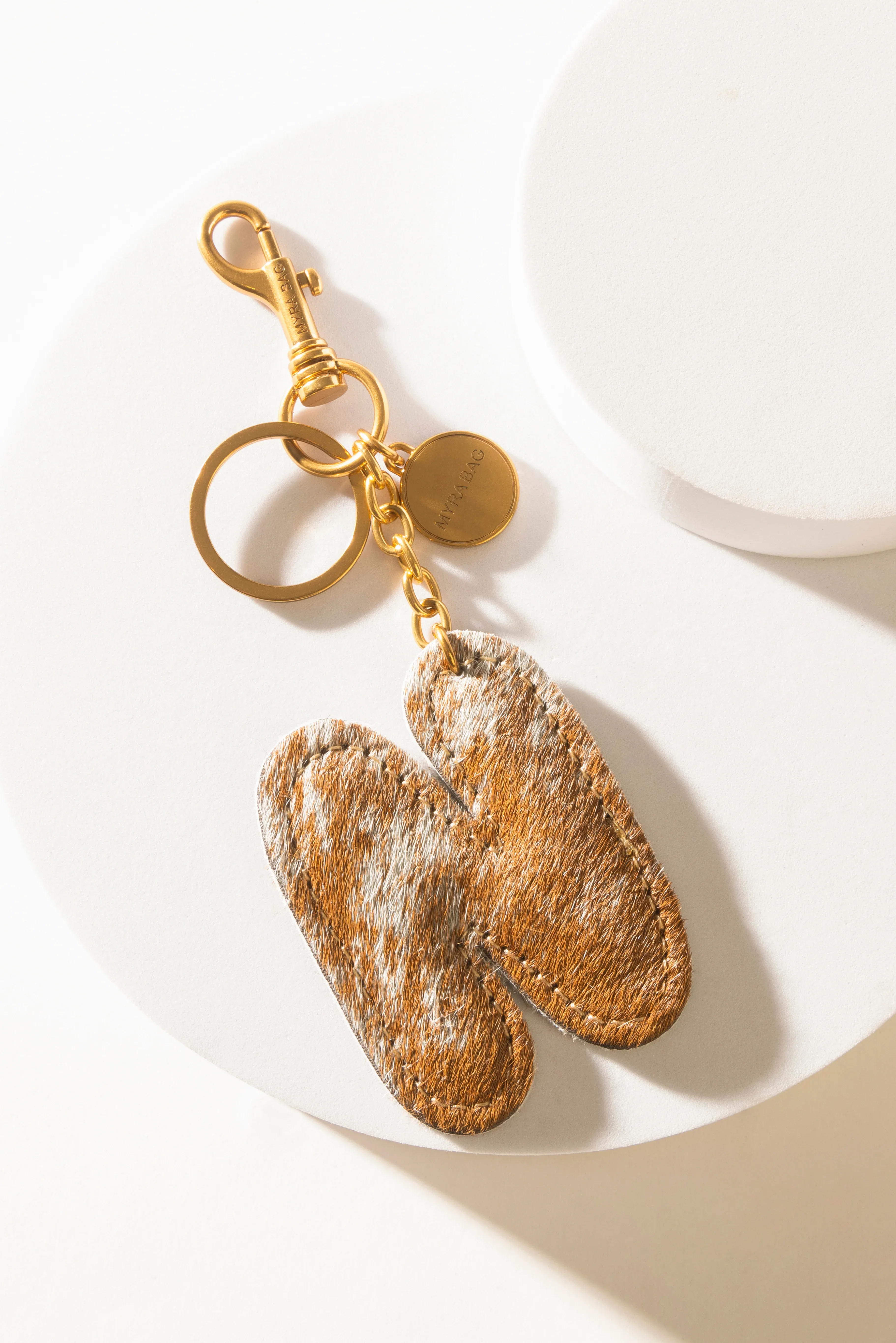 364-alpha-hairon-bag-charm-in-brown-white-1.webp