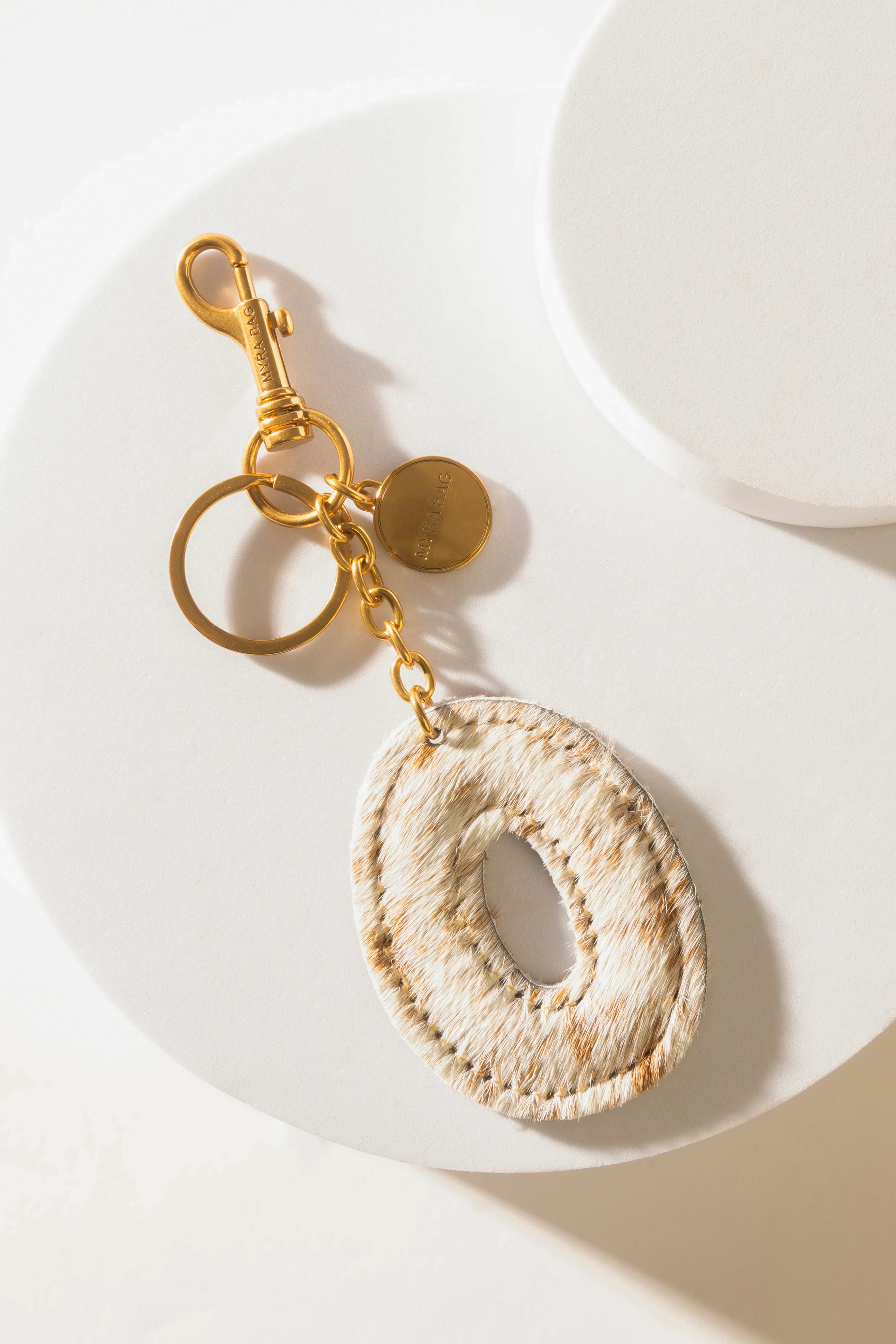 364-alpha-hairon-bag-charm-in-brown-white-1.webp