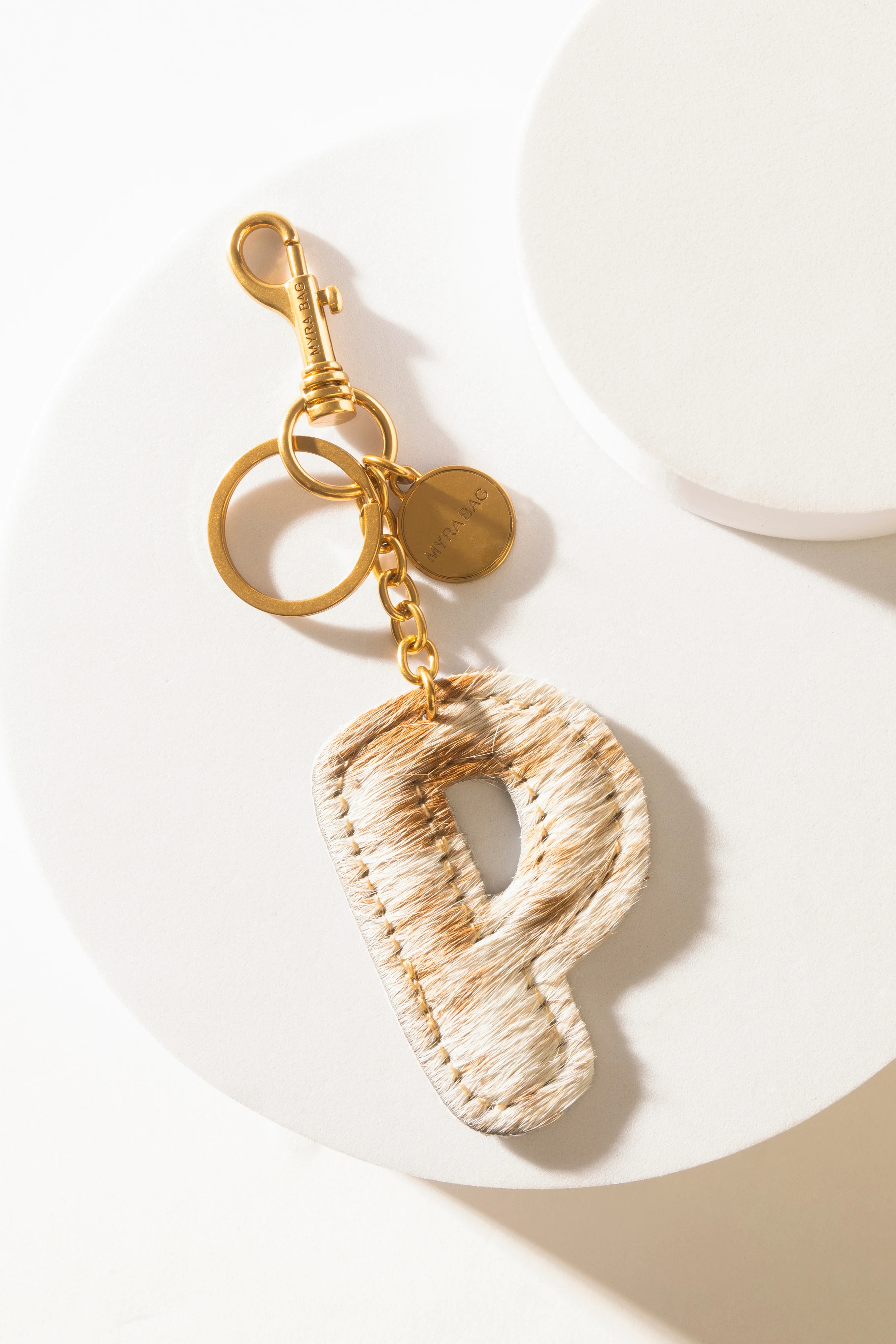 364-alpha-hairon-bag-charm-in-brown-white-1.webp