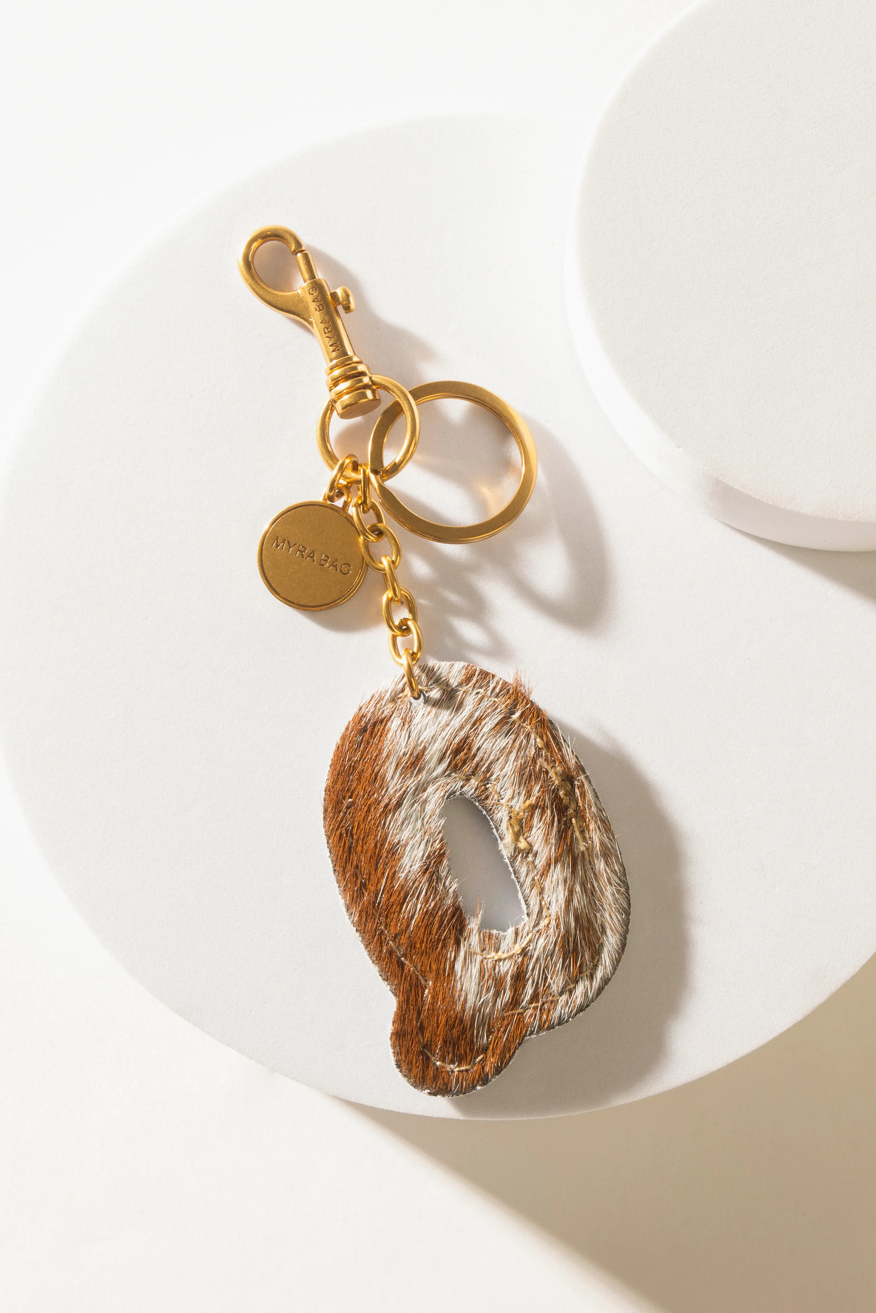 364-alpha-hairon-bag-charm-in-brown-white-1.webp