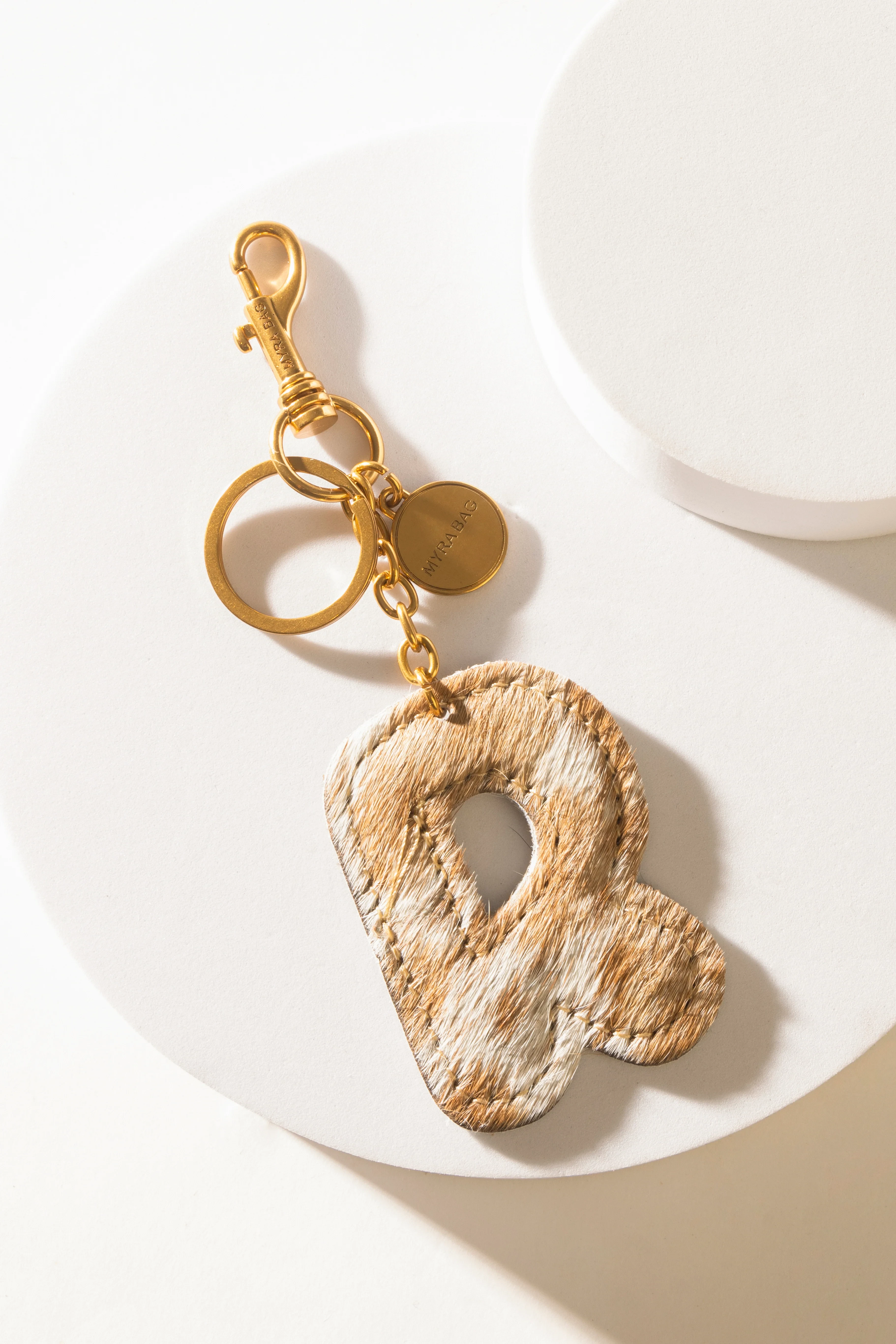 364-alpha-hairon-bag-charm-in-brown-white-1.webp