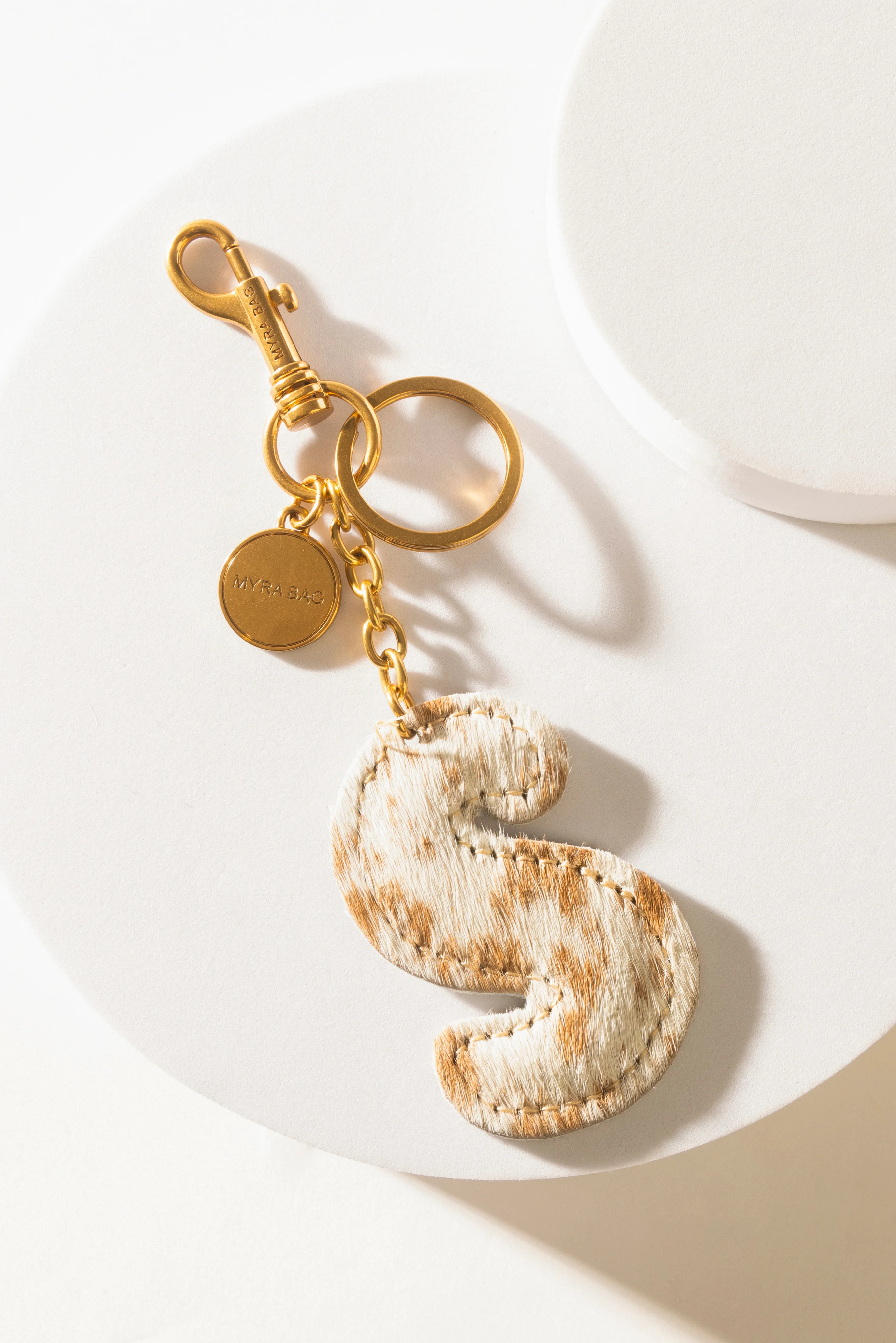 364-alpha-hairon-bag-charm-in-brown-white-1.webp