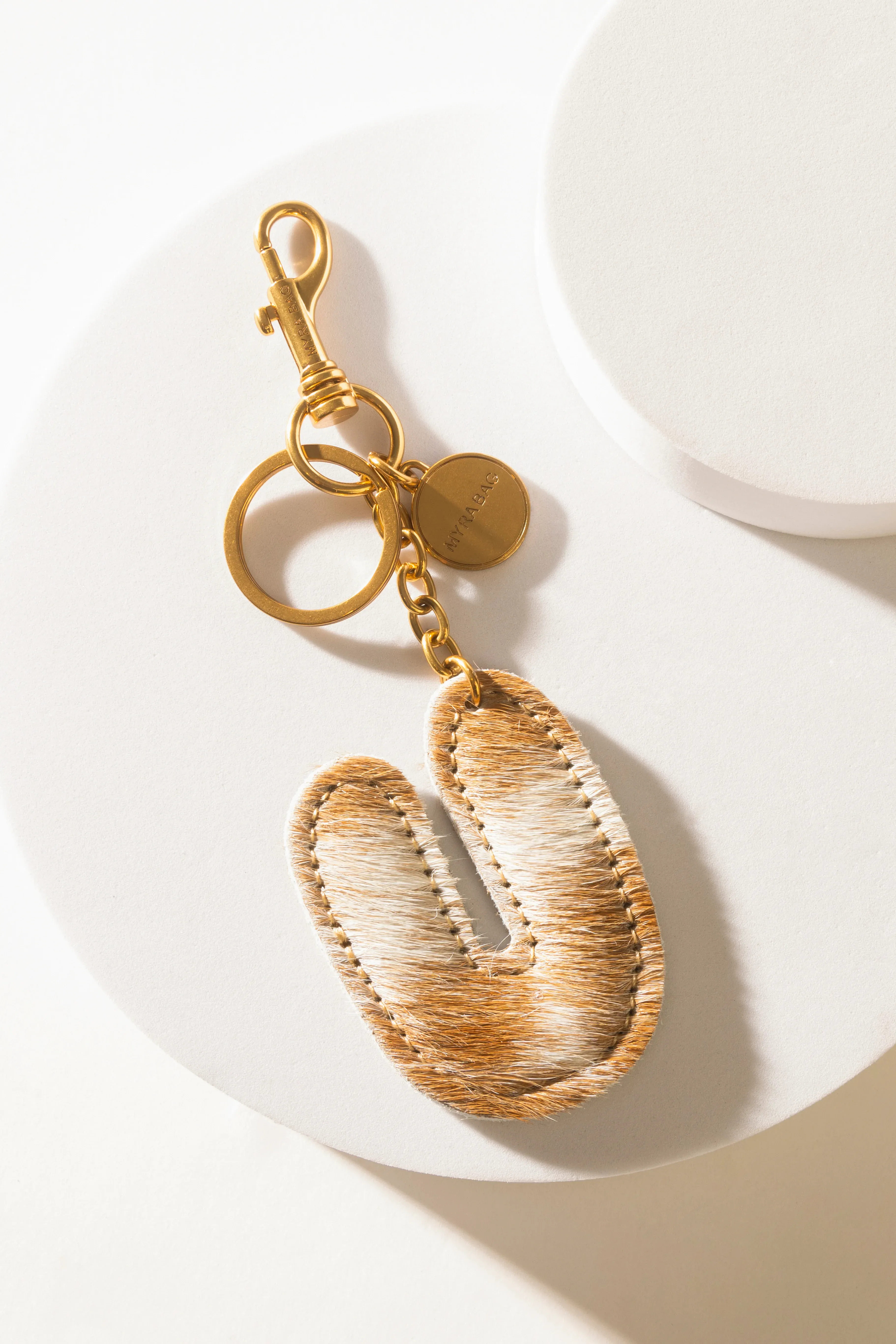 364-alpha-hairon-bag-charm-in-brown-white-1.webp