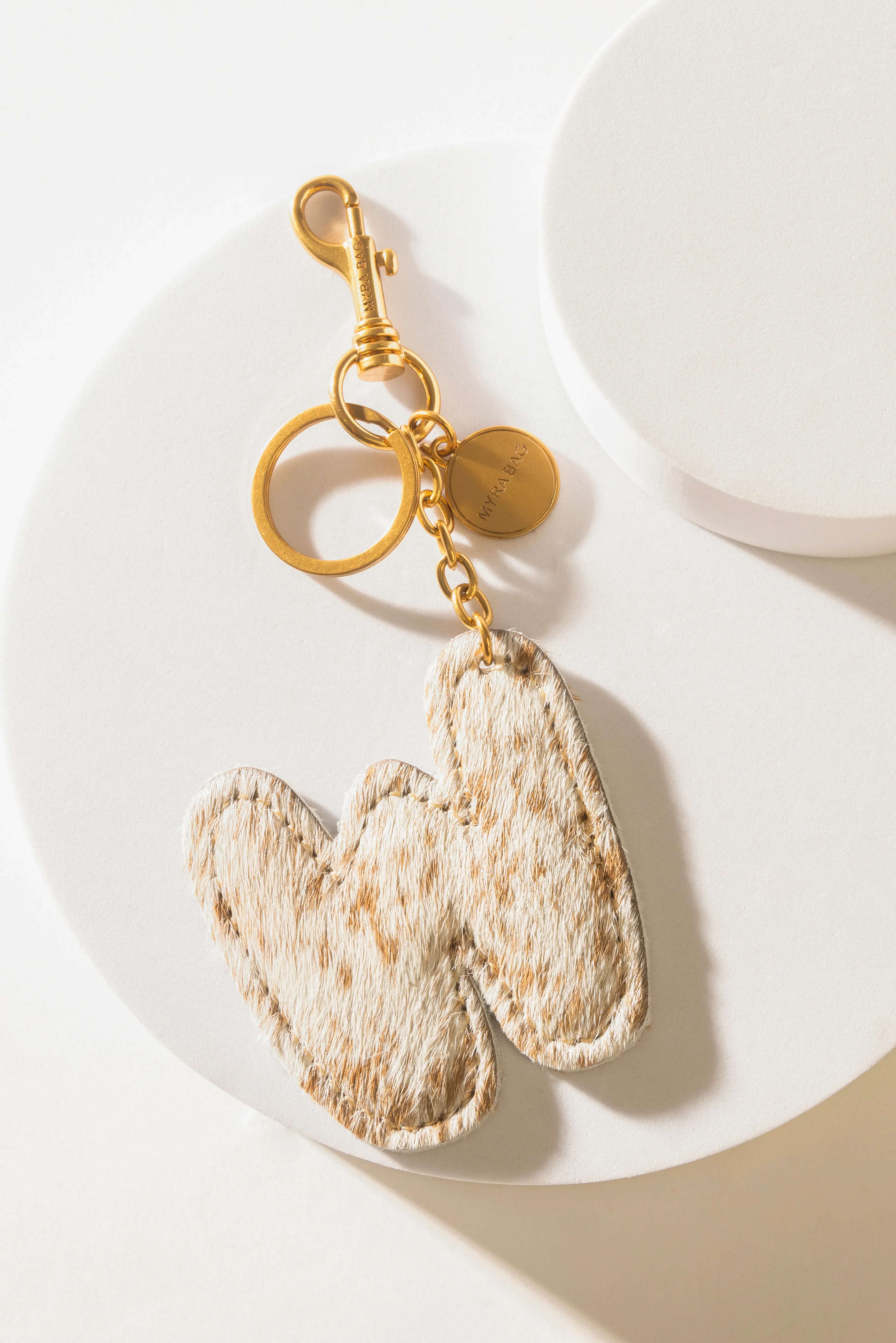 364-alpha-hairon-bag-charm-in-brown-white-1.webp