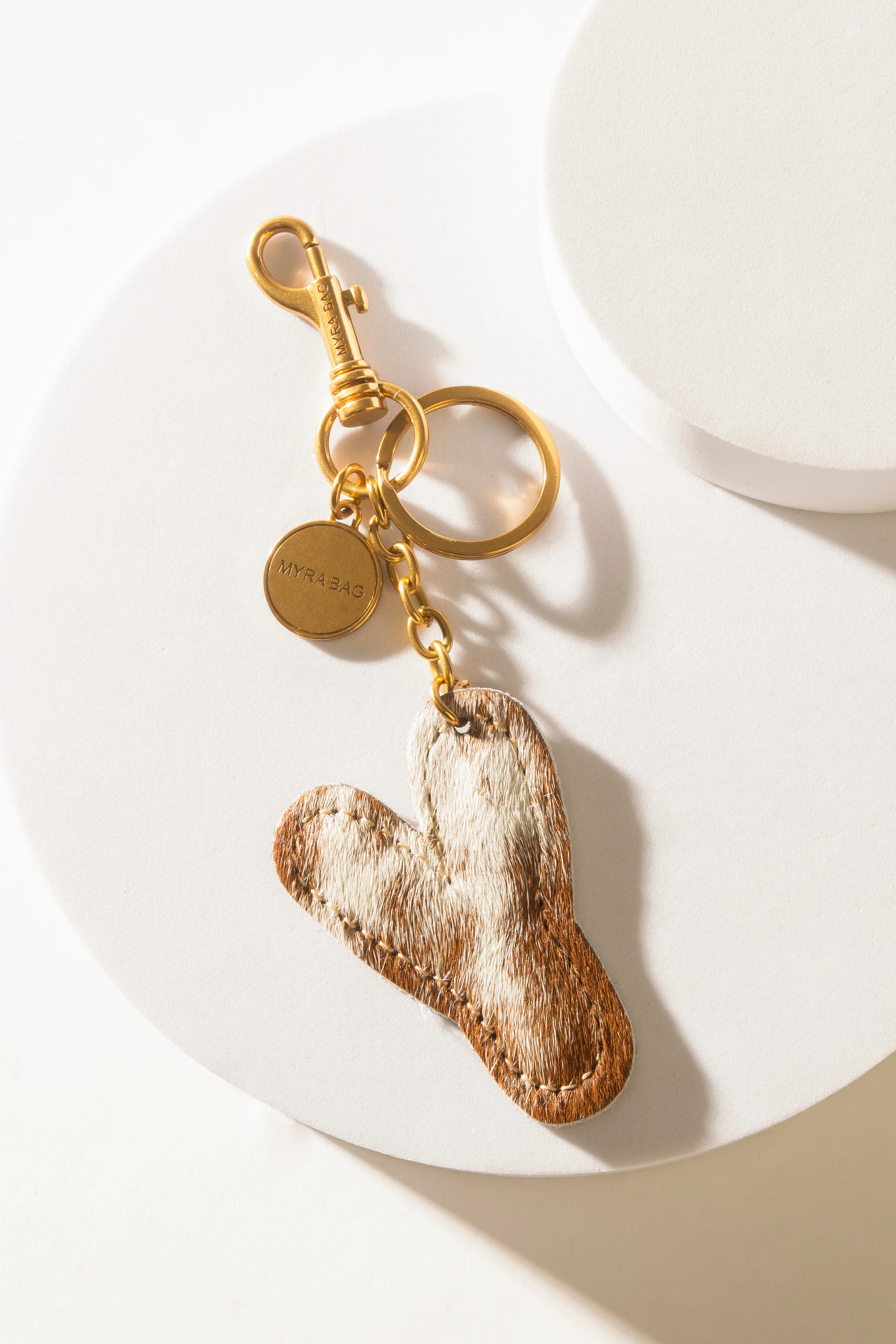364-alpha-hairon-bag-charm-in-brown-white-1.webp