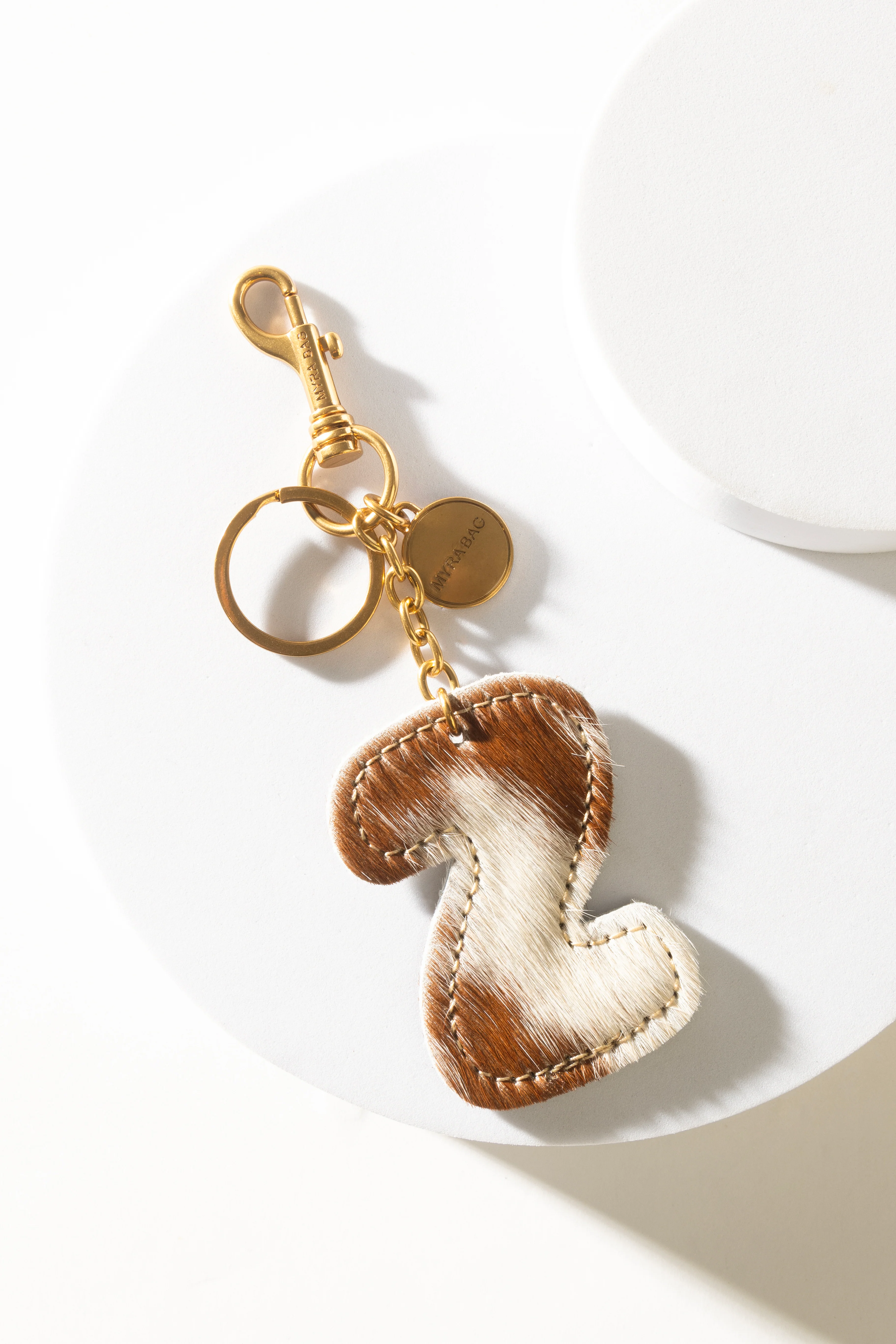 364-alpha-hairon-bag-charm-in-brown-white-1.webp
