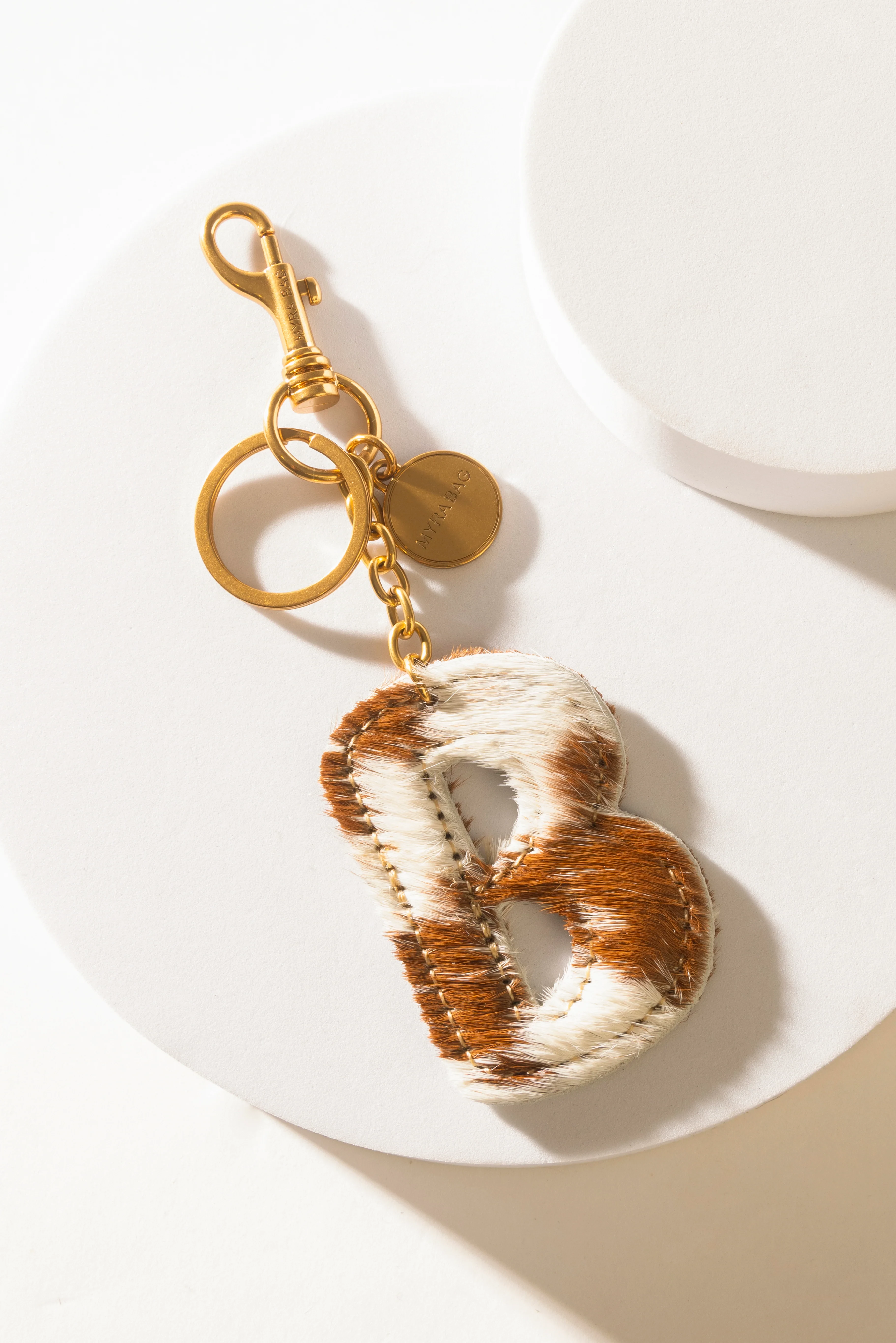 364-alpha-hairon-bag-charm-in-brown-white-1.webp