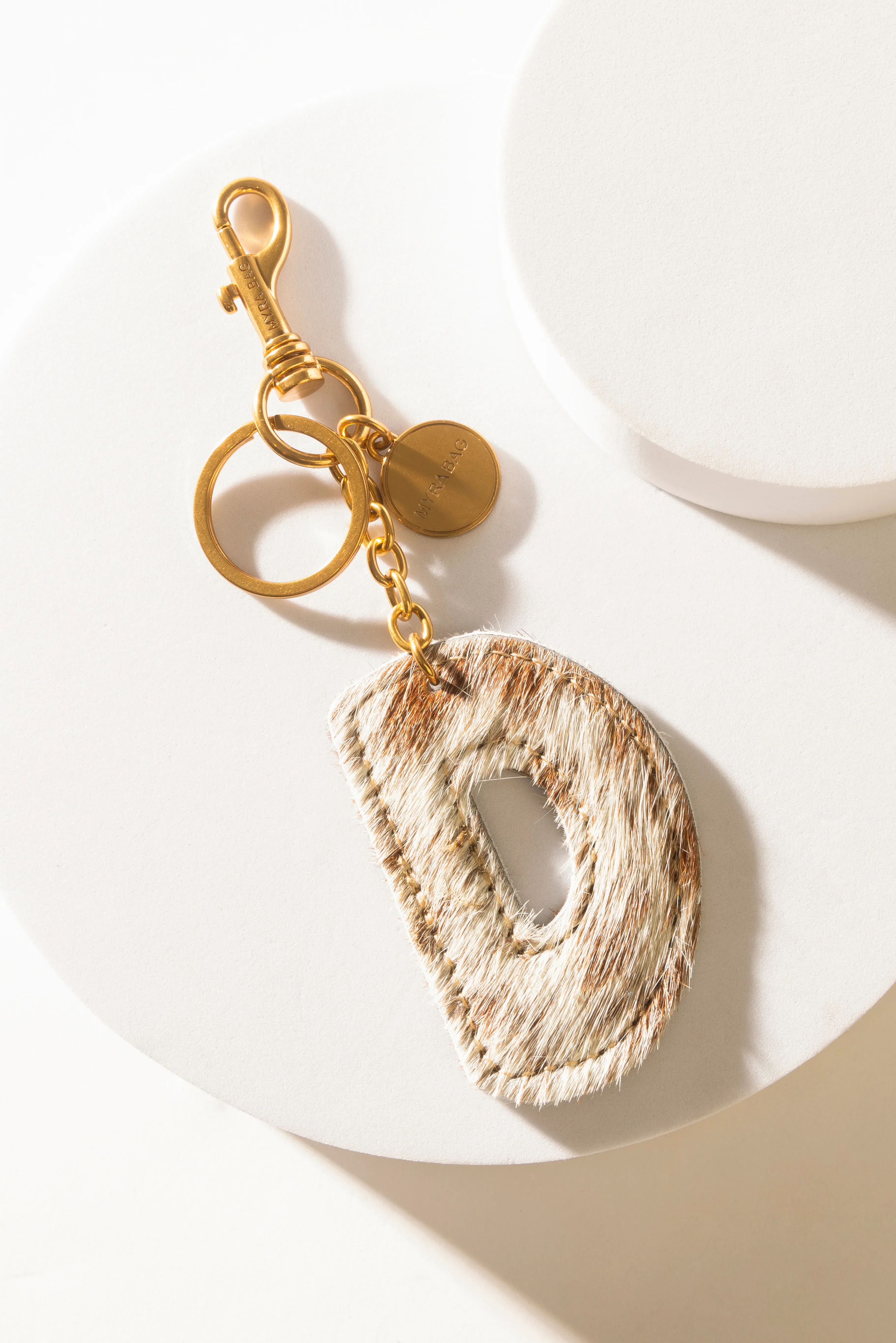 364-alpha-hairon-bag-charm-in-brown-white-1.webp