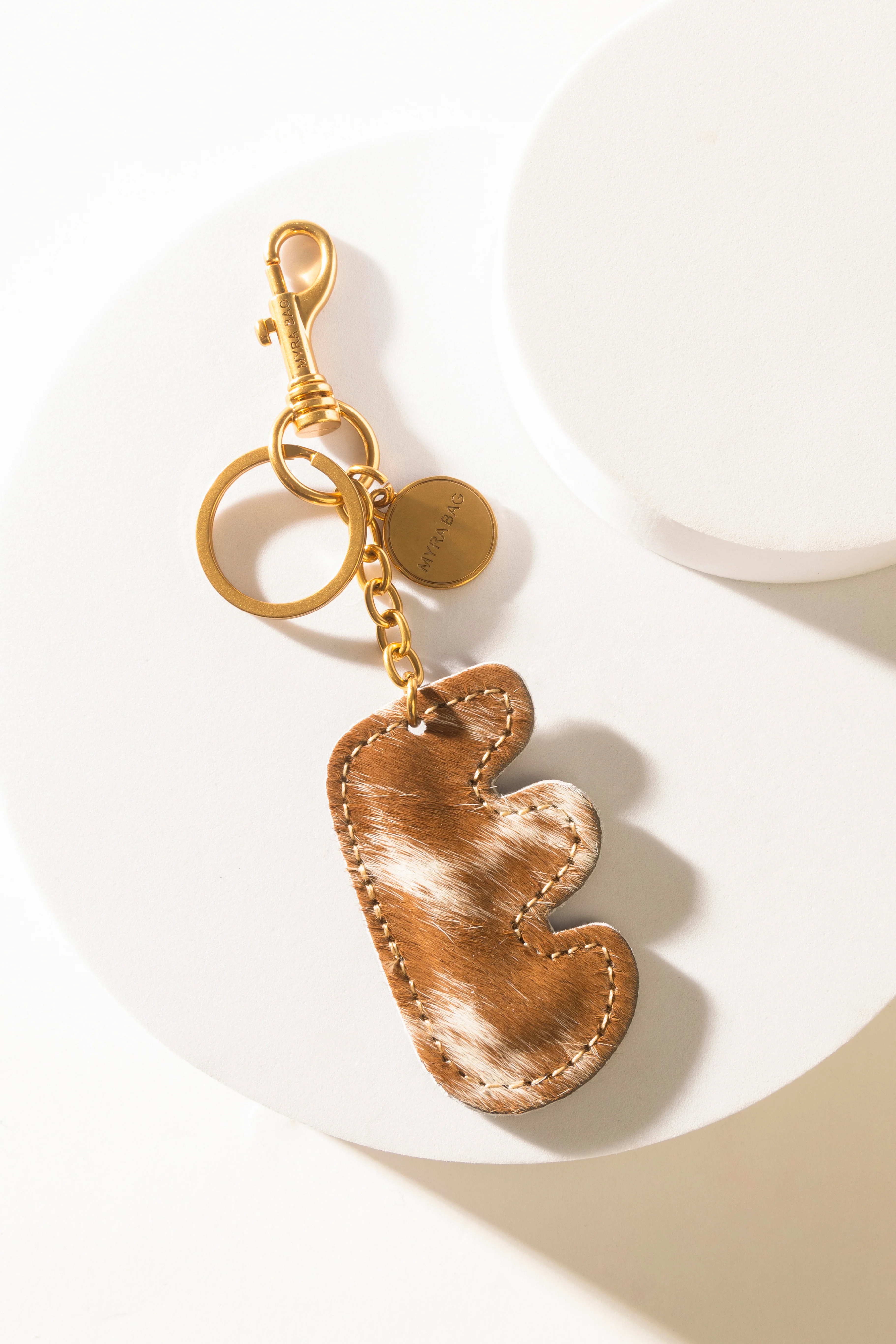 364-alpha-hairon-bag-charm-in-brown-white-1.webp