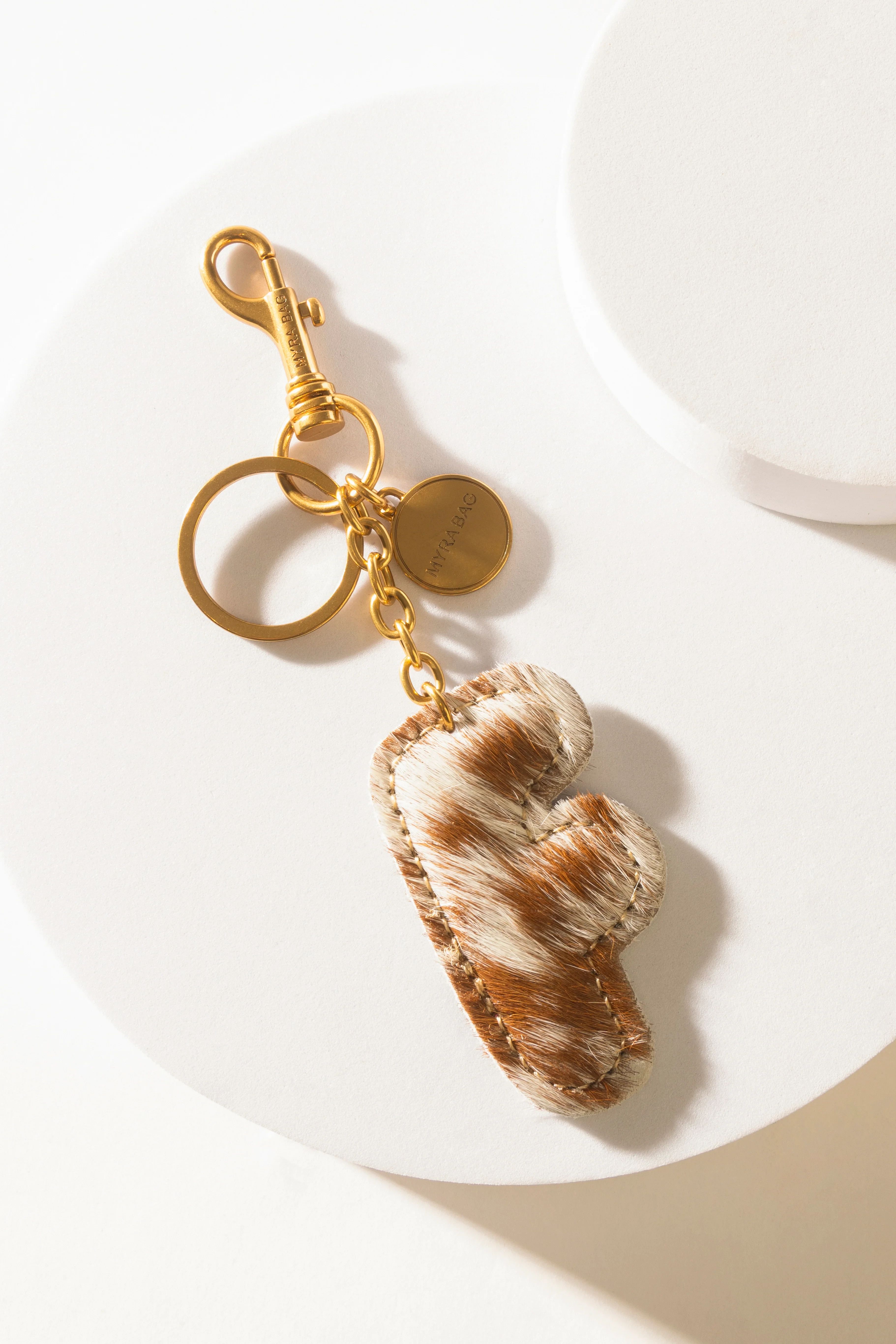 364-alpha-hairon-bag-charm-in-brown-white-1.webp