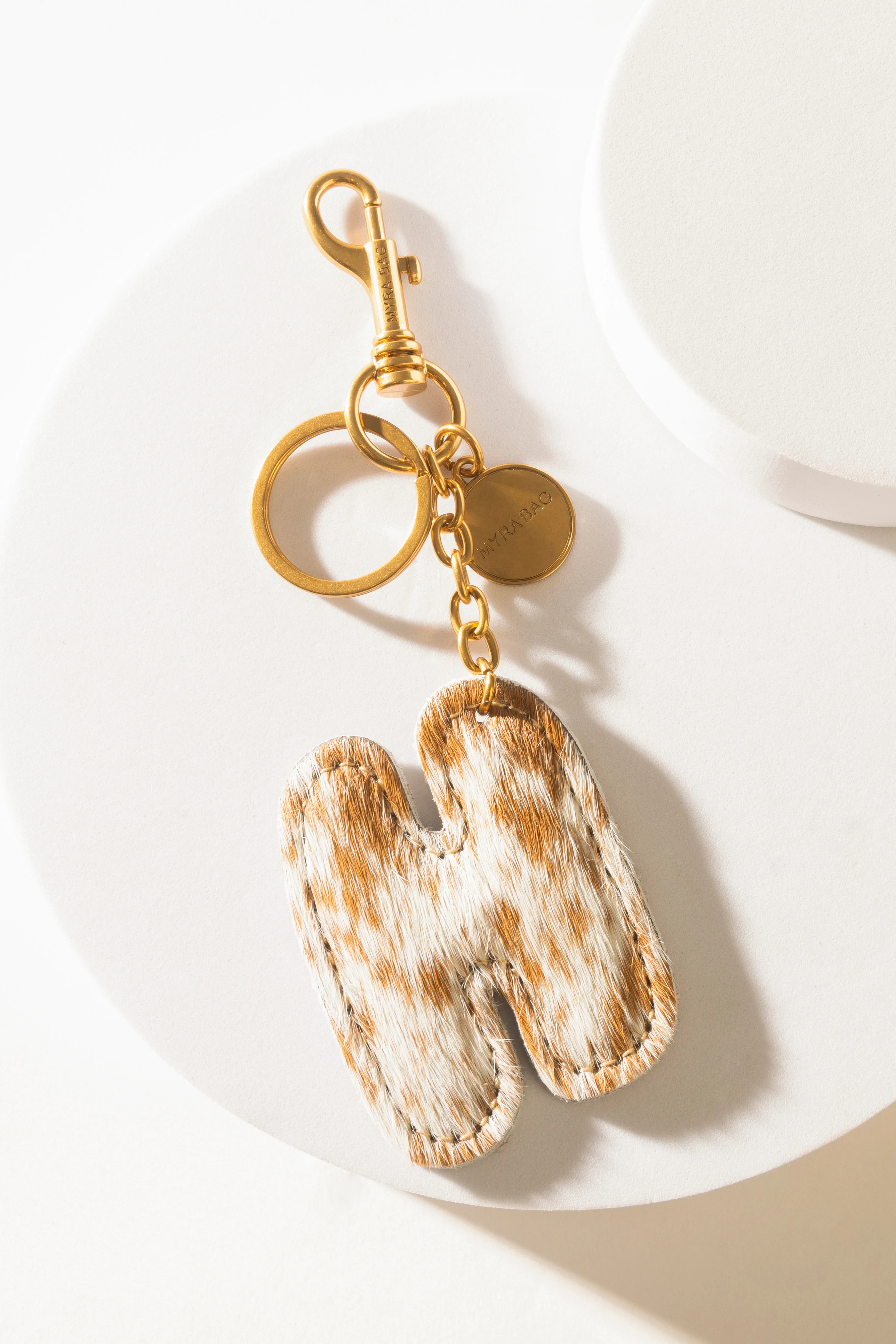 364-alpha-hairon-bag-charm-in-brown-white-1.webp