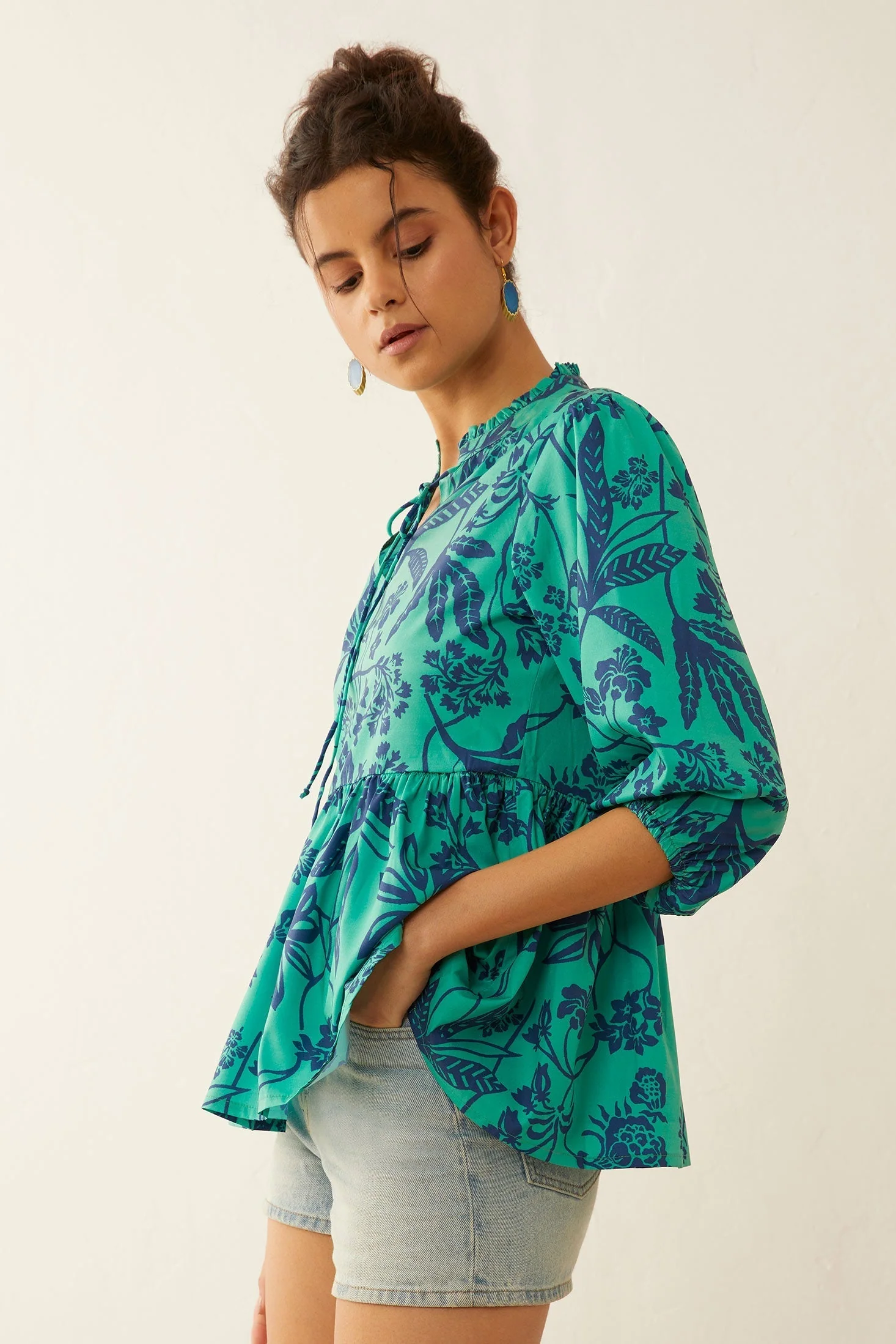 676-artemis-floral-peplum-top-1.webp