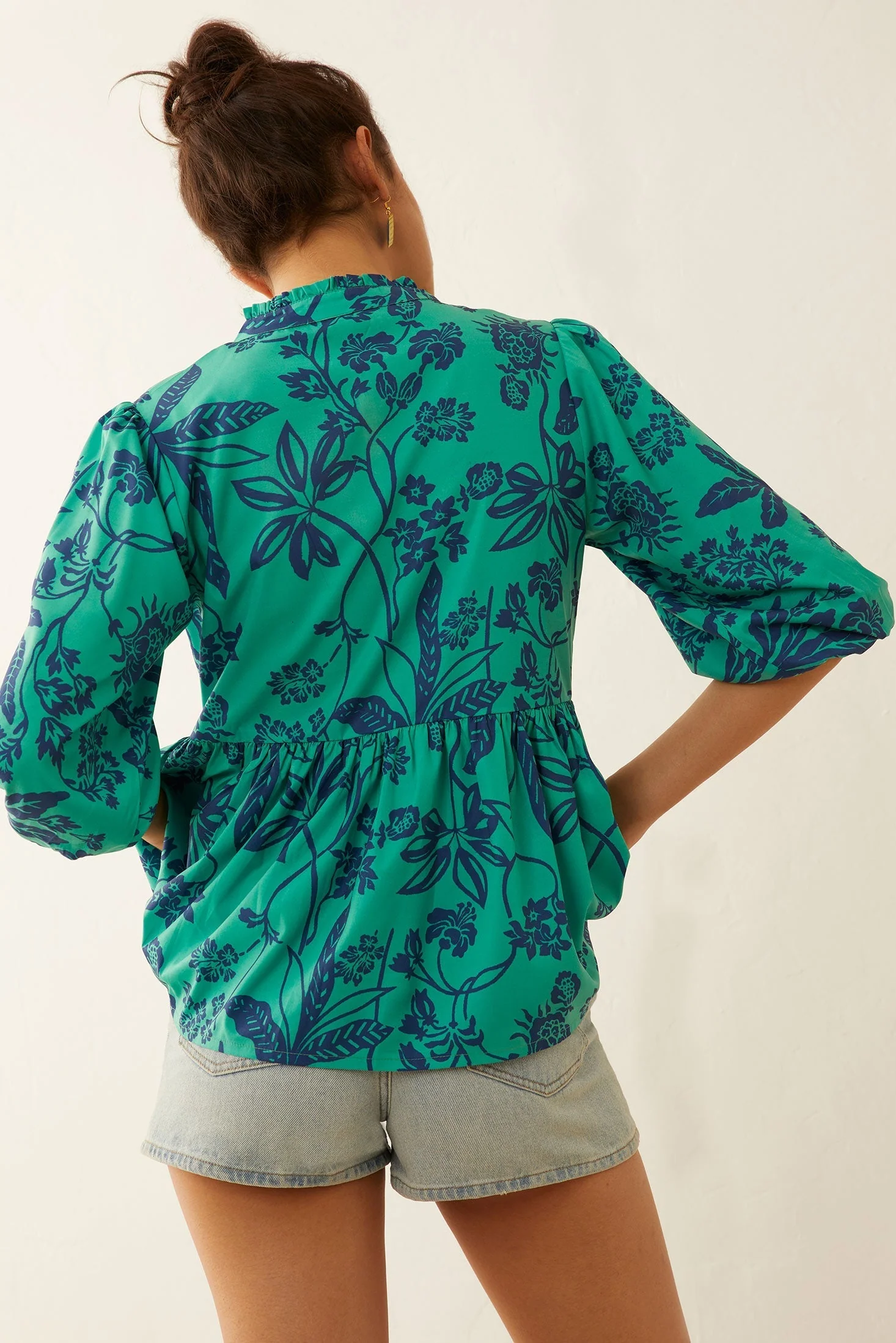 676-artemis-floral-peplum-top-1.webp