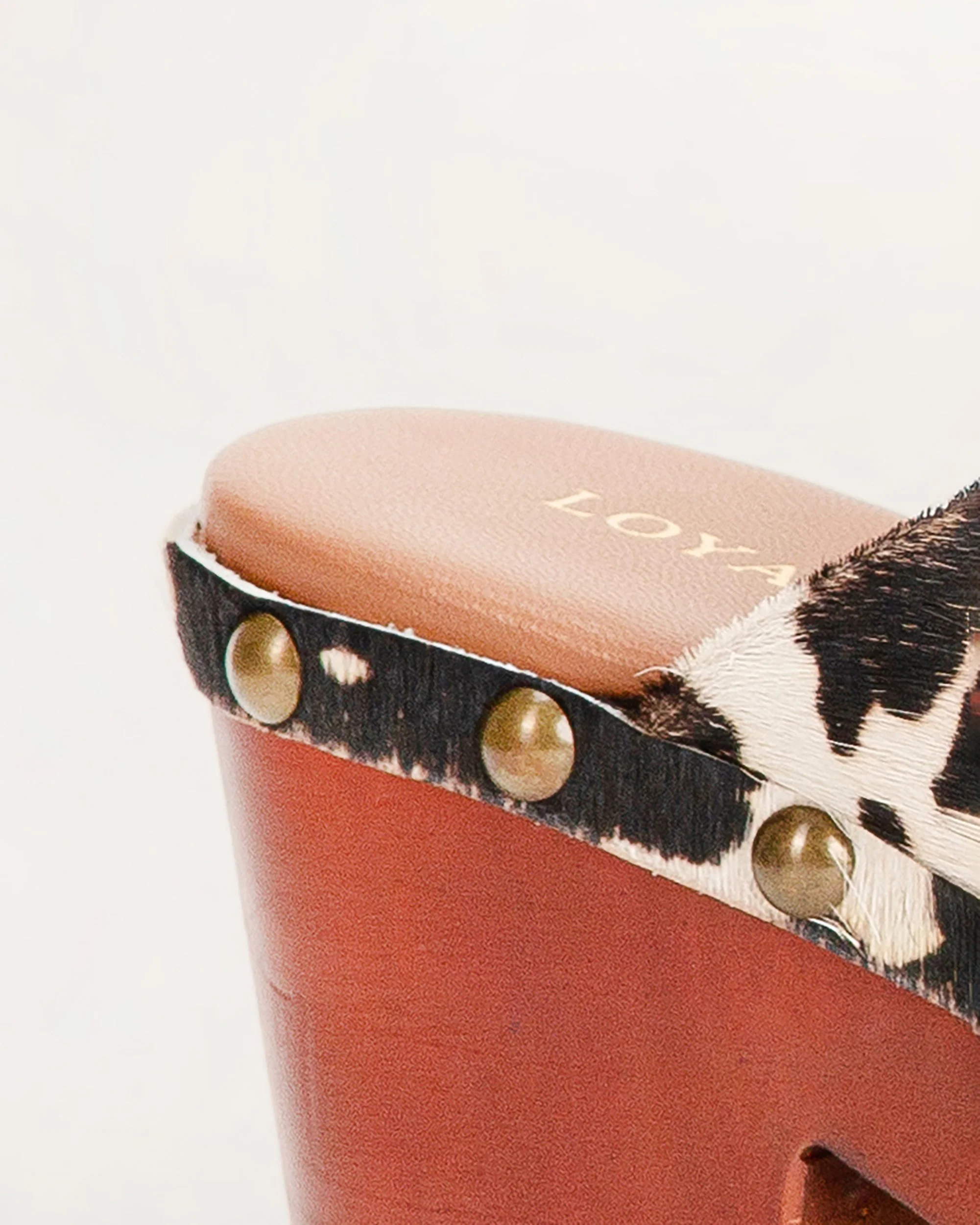 7508-loyal-west-carlotta-trail-clogs-black-and-white-cowhide-1.webp