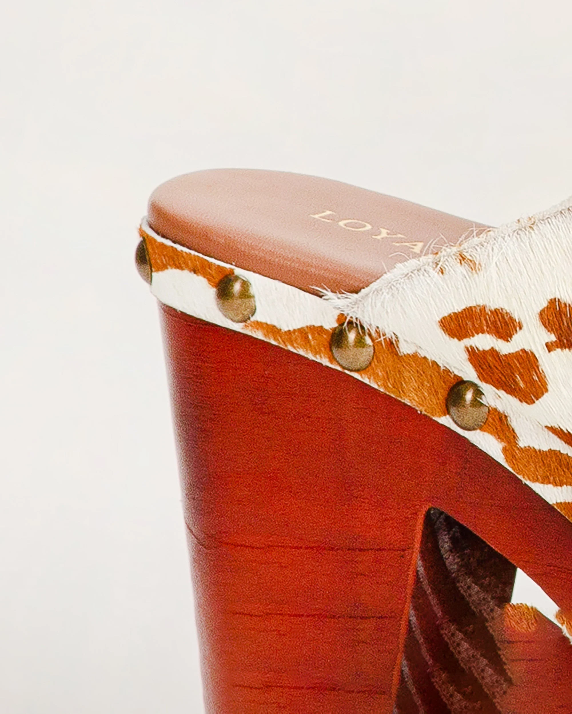 7515-loyal-west-carlotta-trail-clogs-brown-and-white-cowhide-1.webp