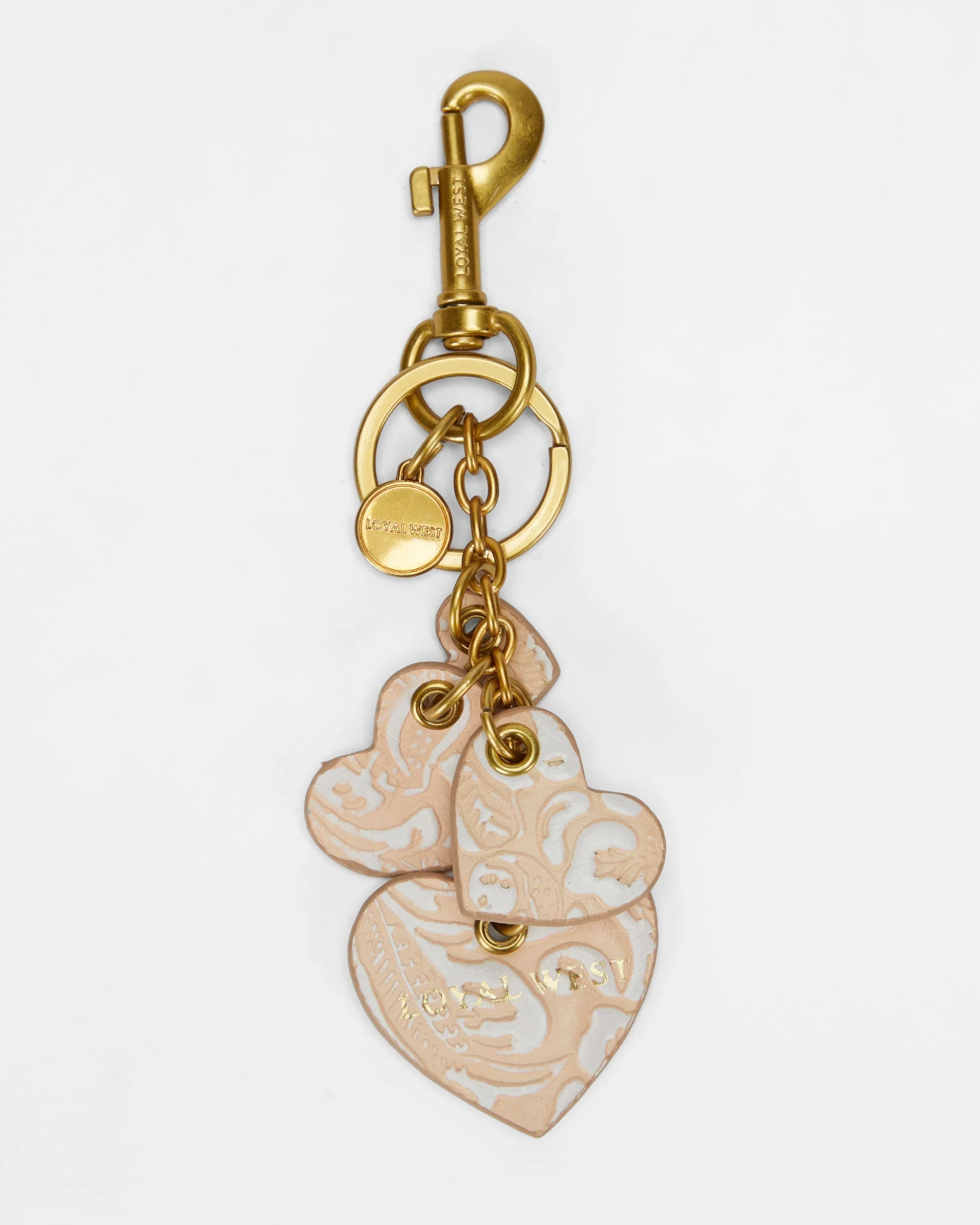 7636-loyal-west-heart-shape-keychain-in-hand-finished-embossed-leather-white-1.webp
