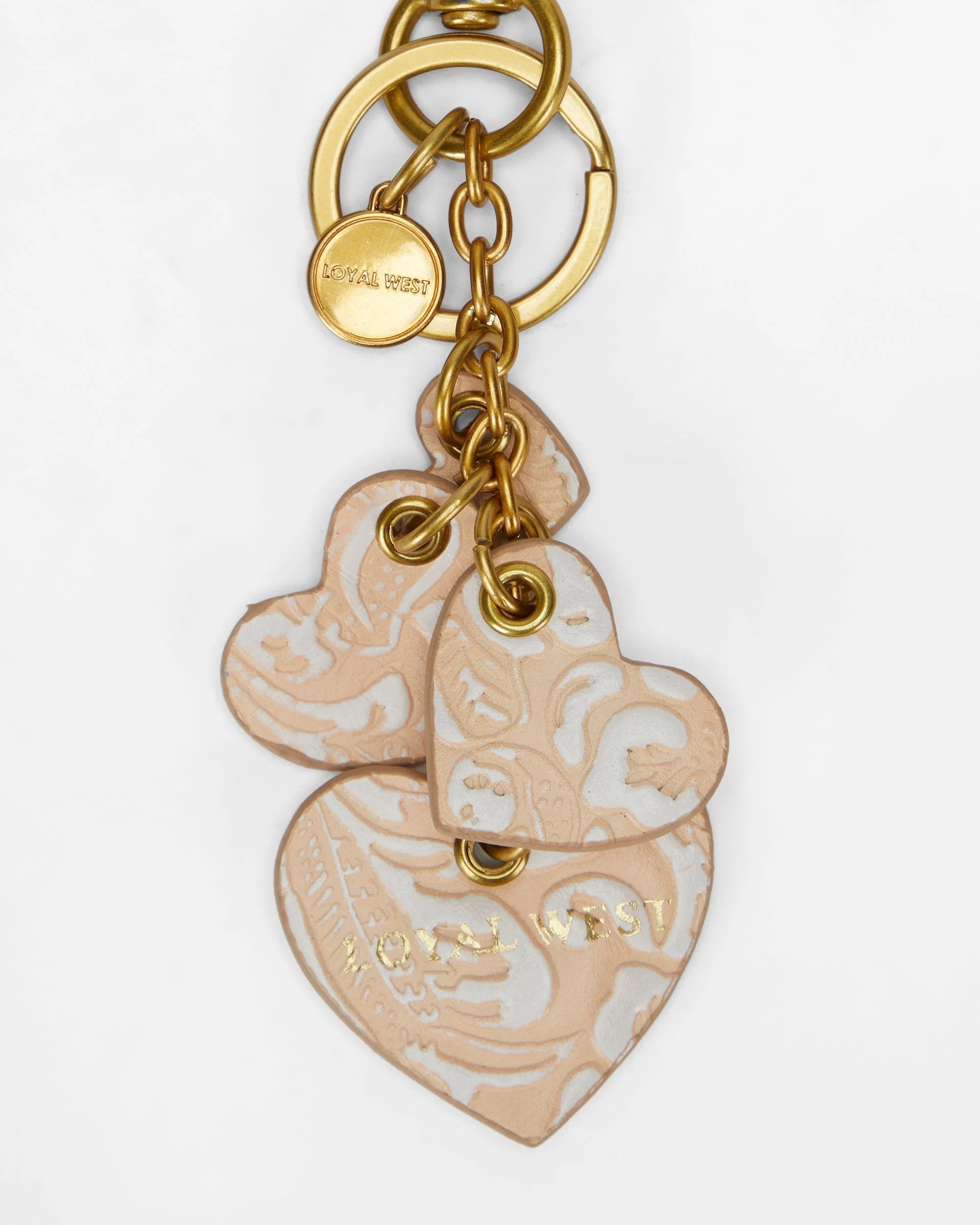 7636-loyal-west-heart-shape-keychain-in-hand-finished-embossed-leather-white-1.webp