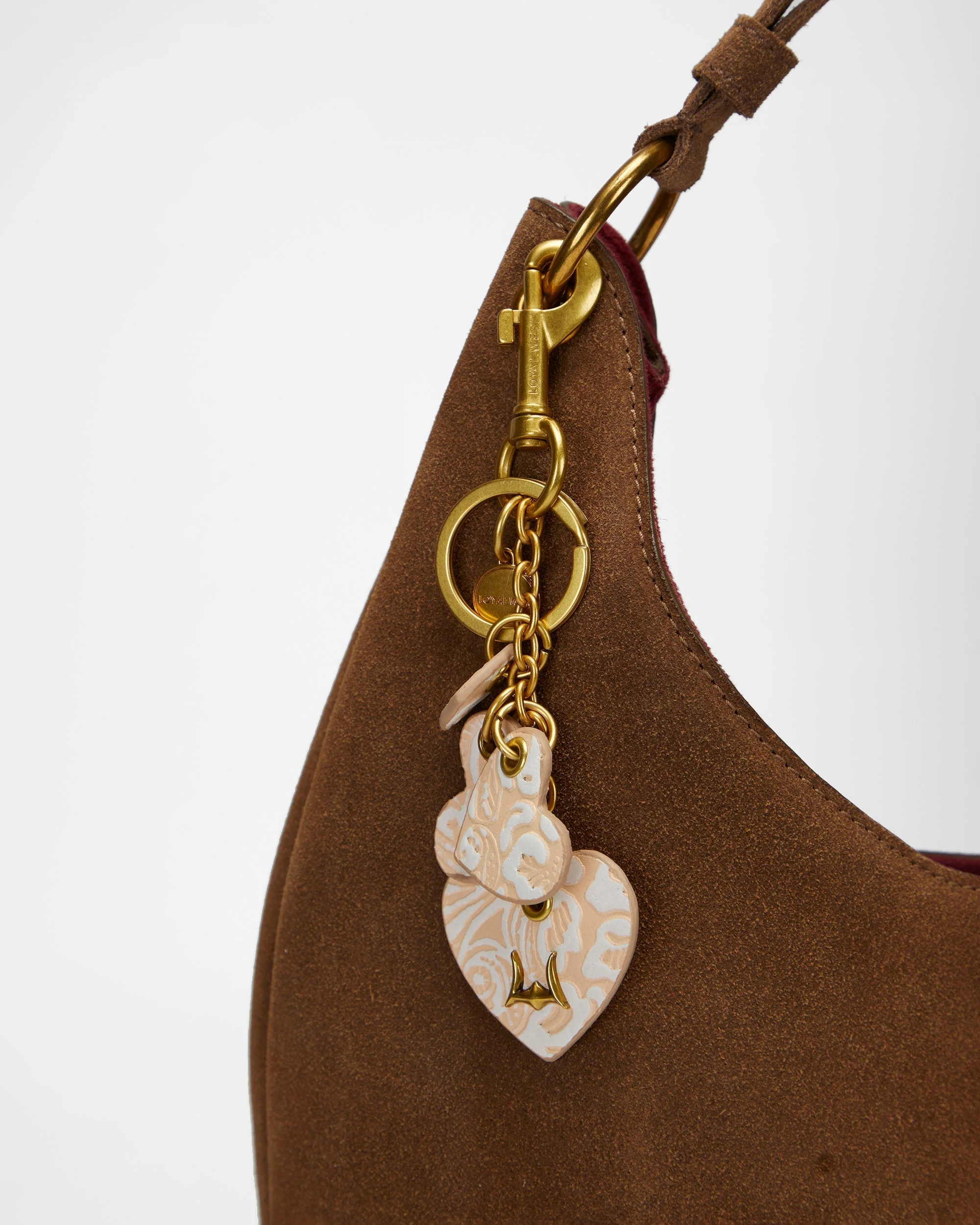 7636-loyal-west-heart-shape-keychain-in-hand-finished-embossed-leather-white-1.webp