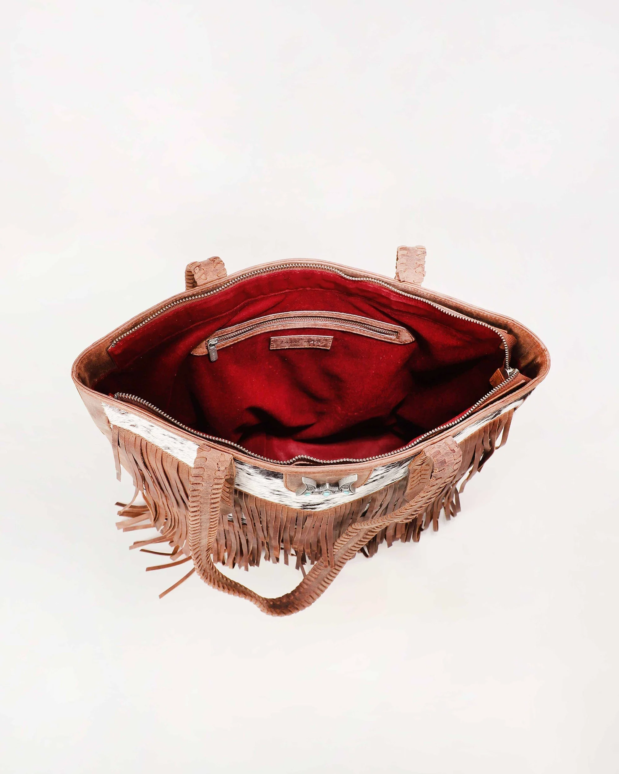 7637-loyal-west-hide-and-fringe-large-cowhide-purse-1.webp