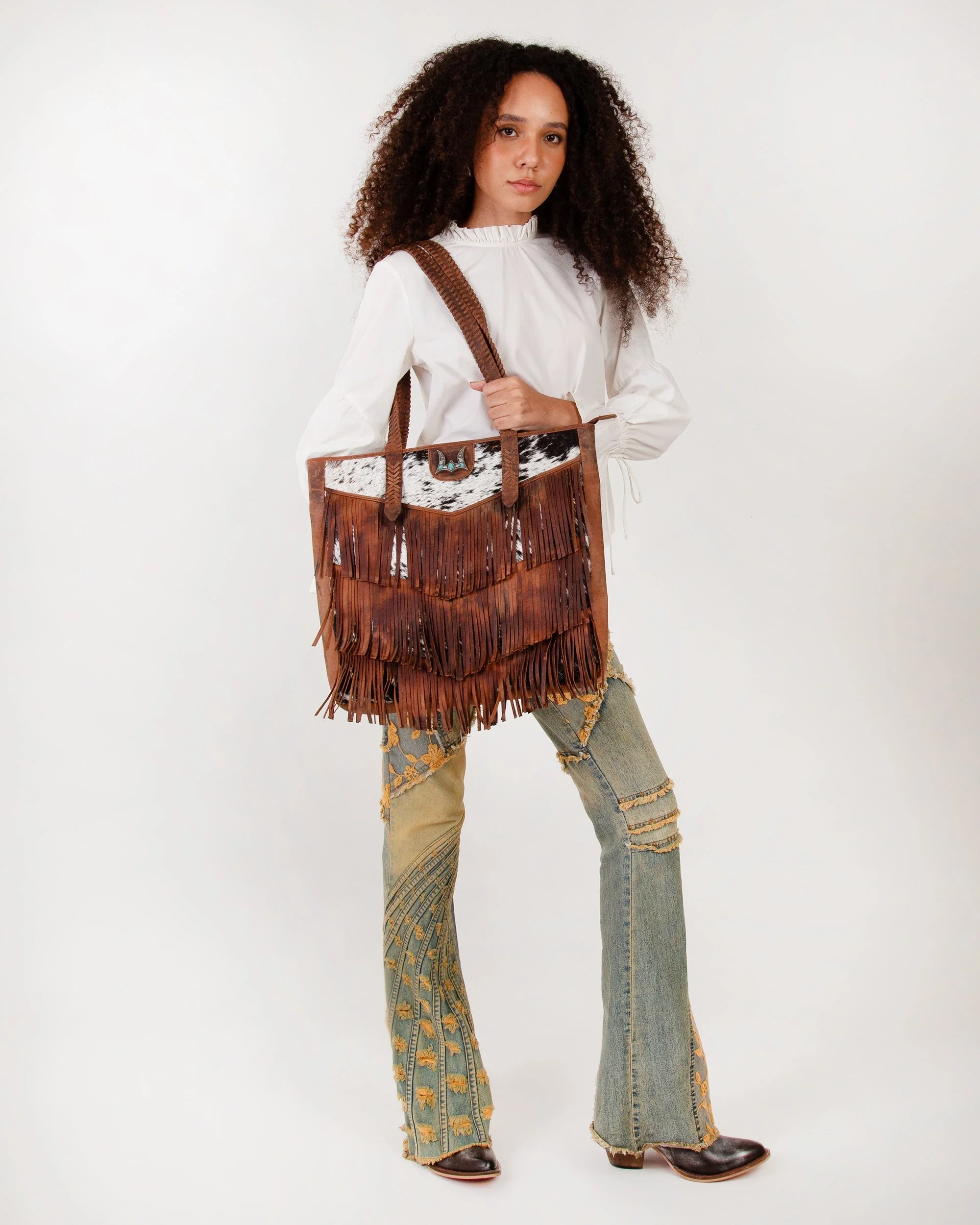 7637-loyal-west-hide-and-fringe-large-cowhide-purse-1.webp