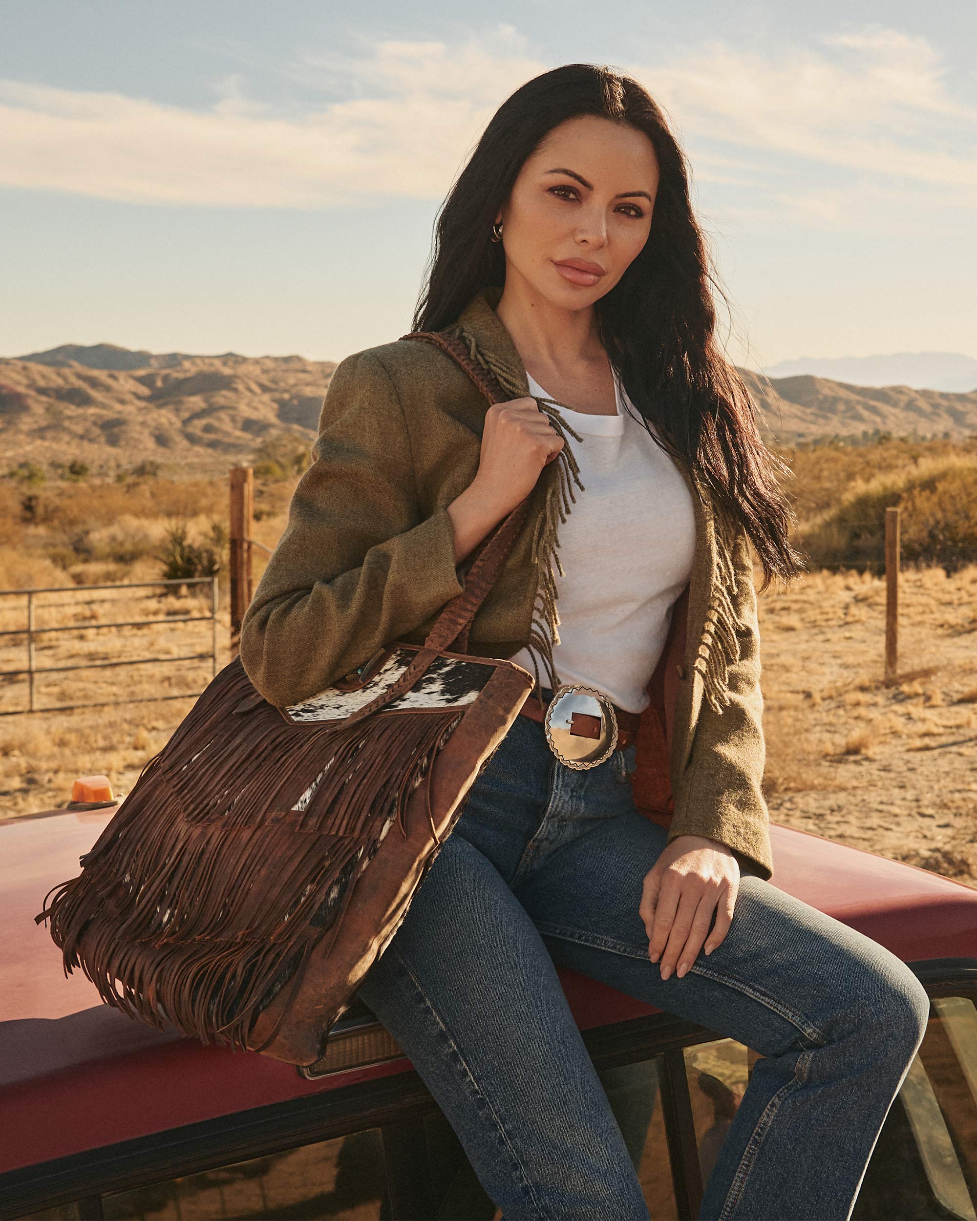 7637-loyal-west-hide-and-fringe-large-cowhide-purse-1.webp