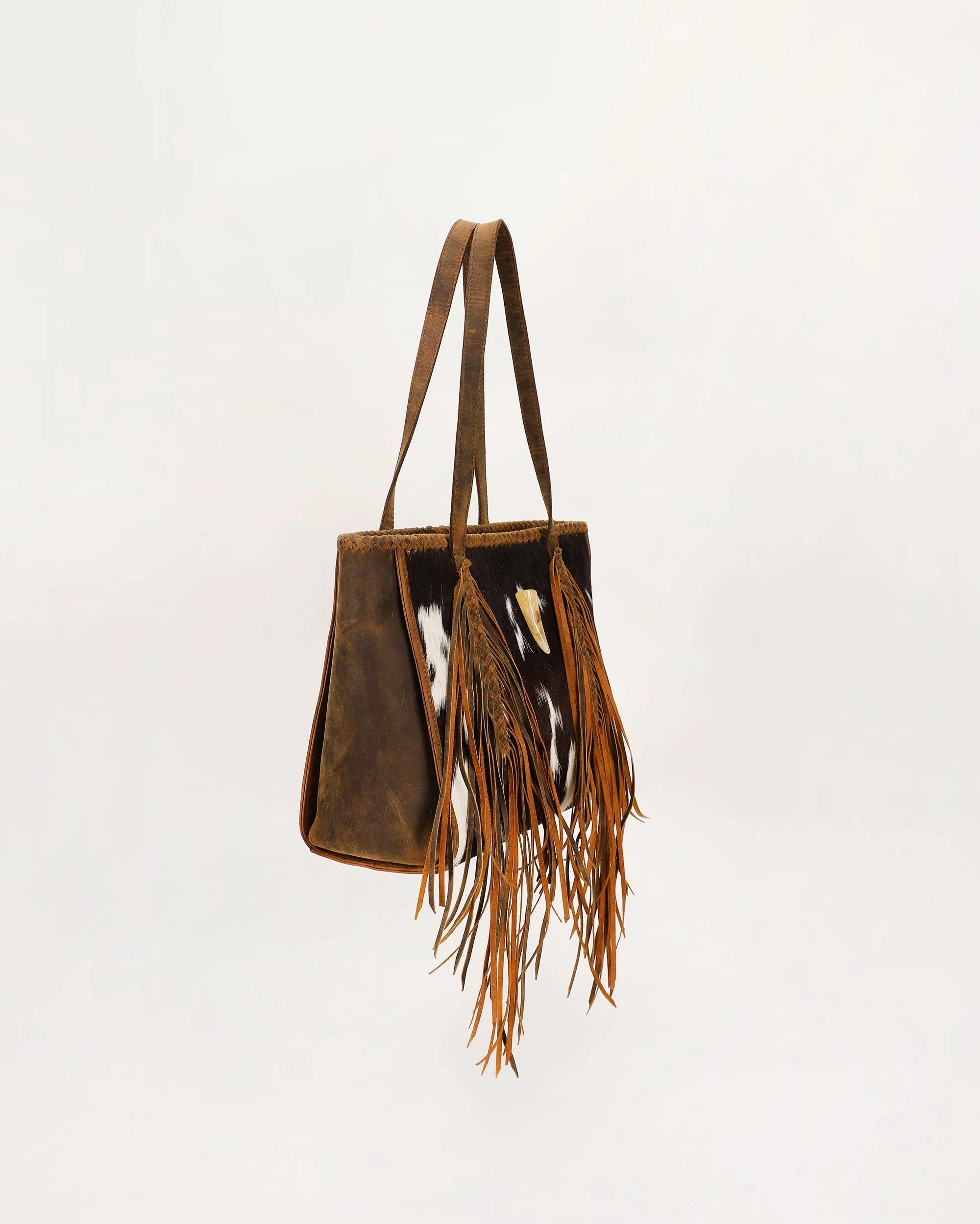 7638-loyal-west-hide-and-fringe-medium-cowhide-purse-1.webp