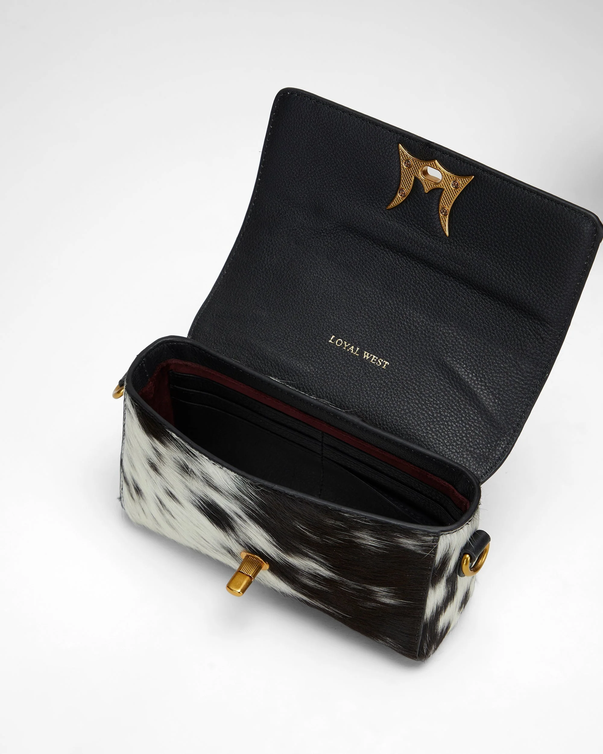 7779-loyal-west-savi-mini-bag-in-black-white-cowhide-1.webp
