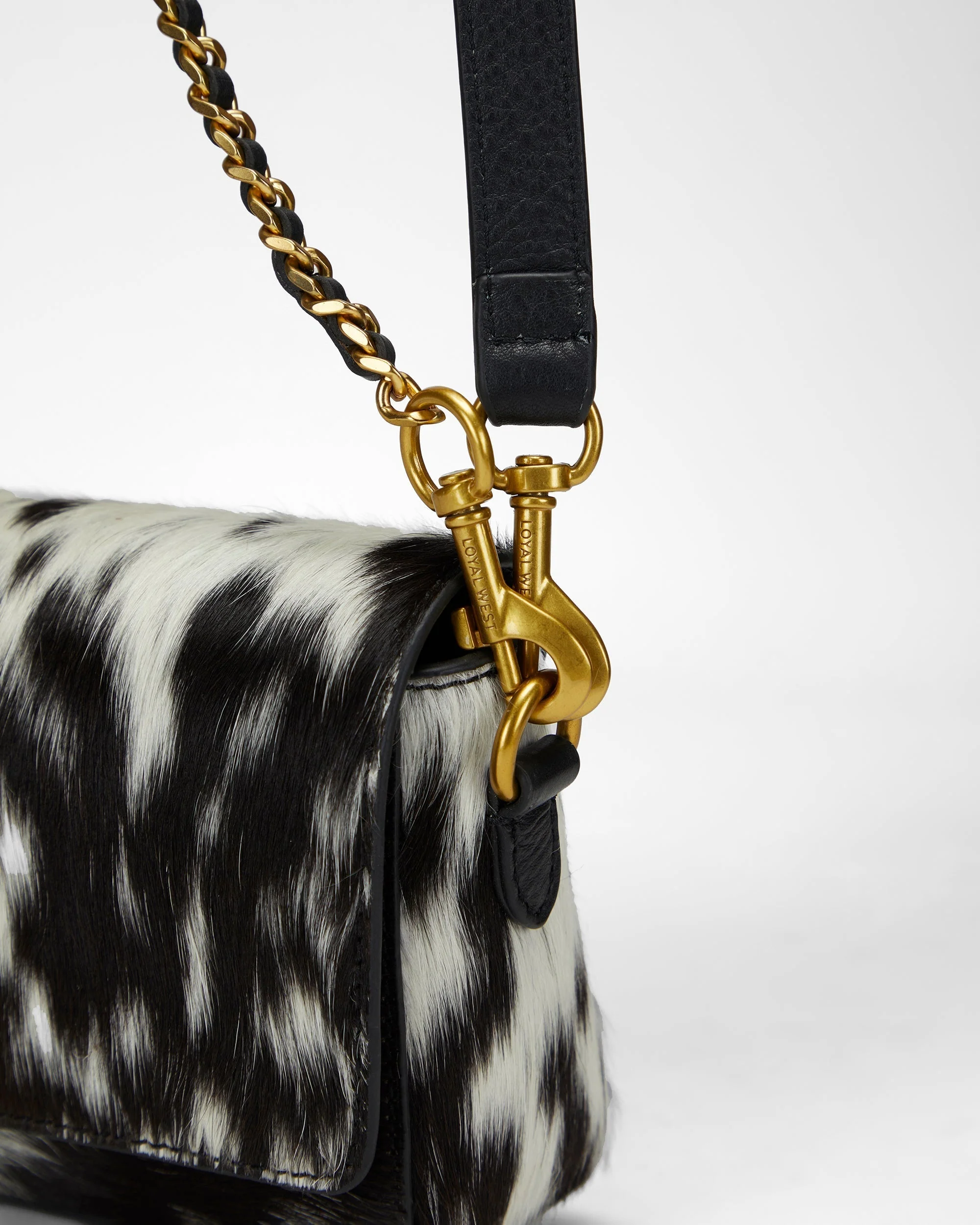 7779-loyal-west-savi-mini-bag-in-black-white-cowhide-1.webp