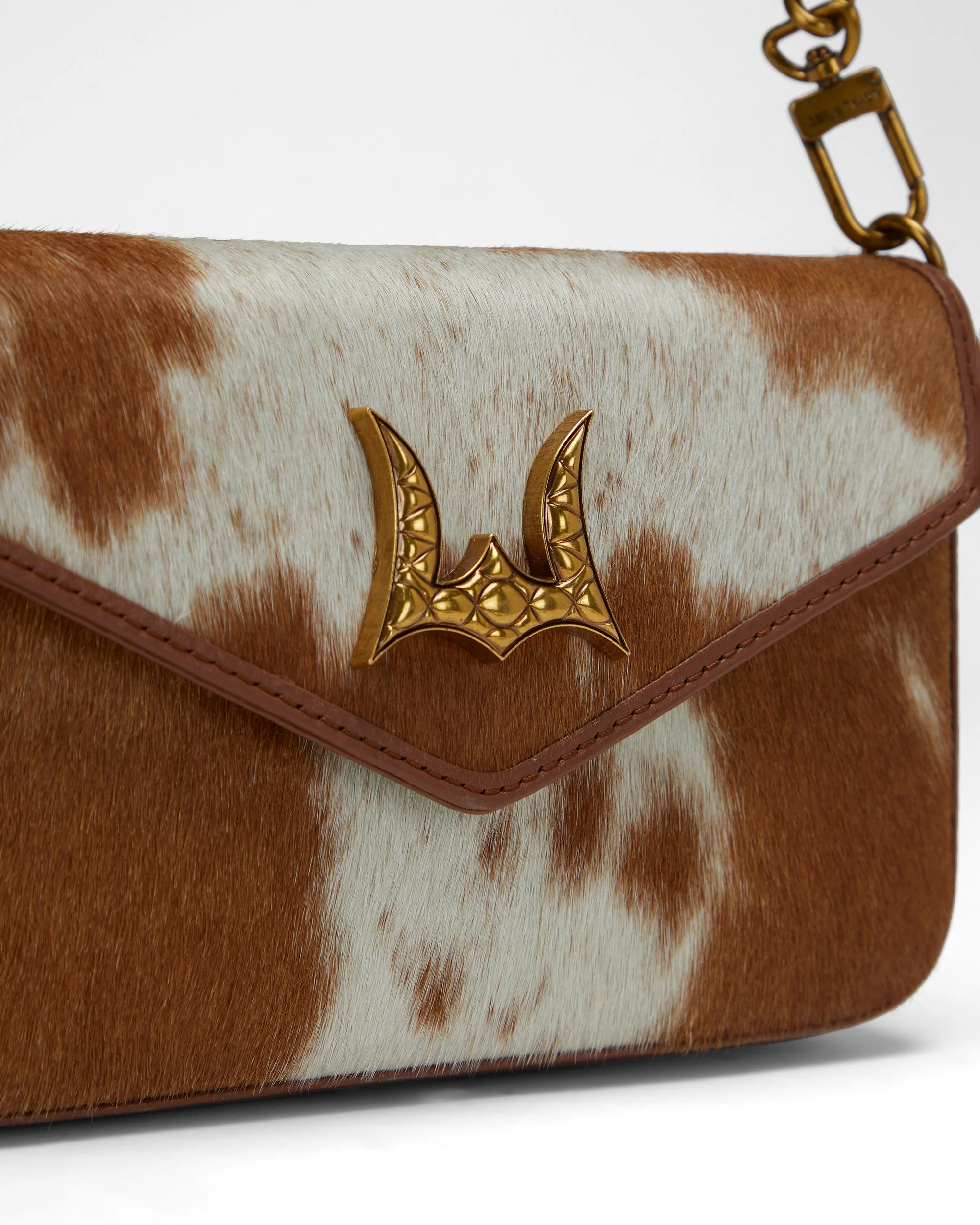 7861-loyal-west-the-lw-on-the-go-mini-chain-bag-in-brown-white-cowhide-and-calfskin-1.webp