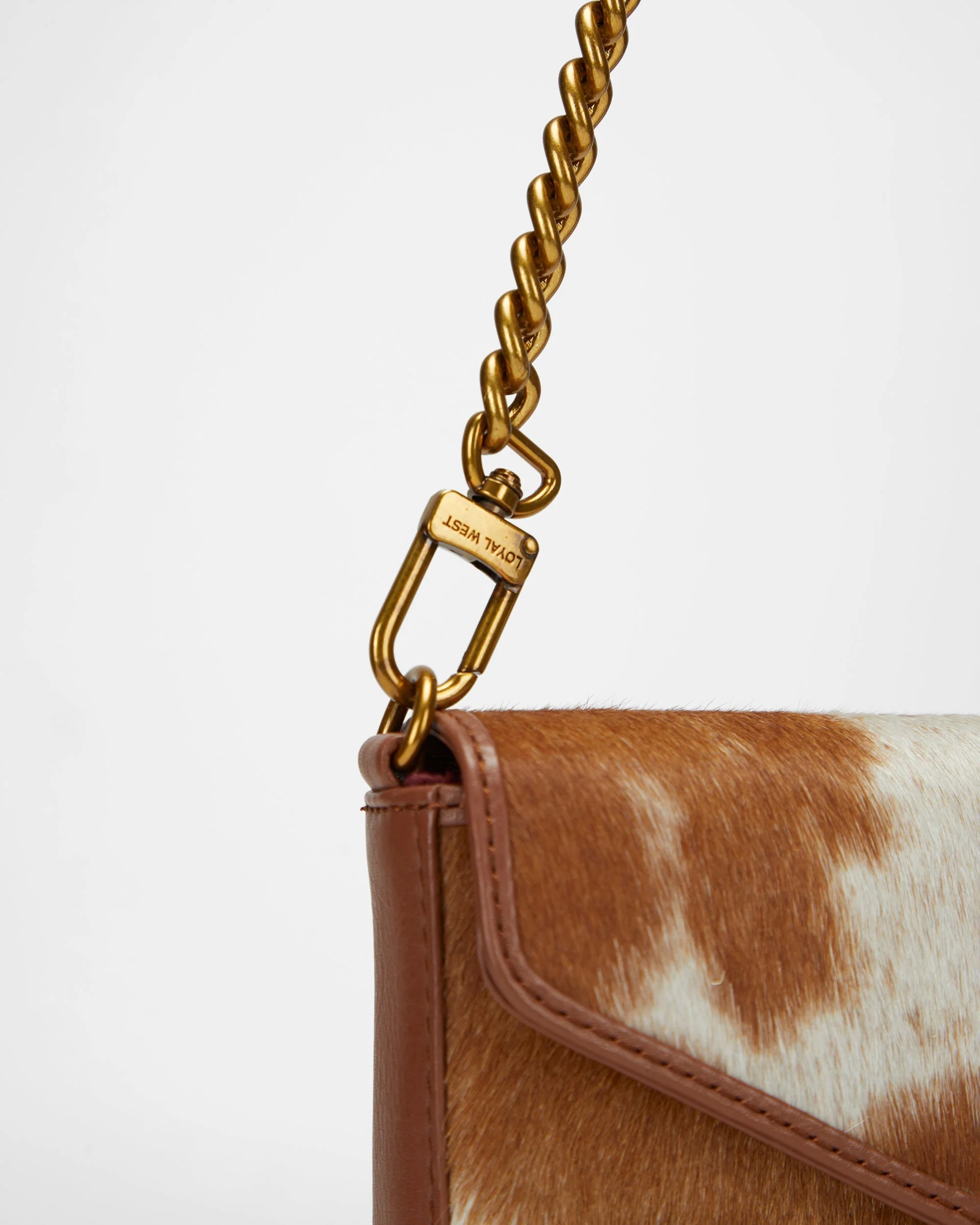 7861-loyal-west-the-lw-on-the-go-mini-chain-bag-in-brown-white-cowhide-and-calfskin-1.webp