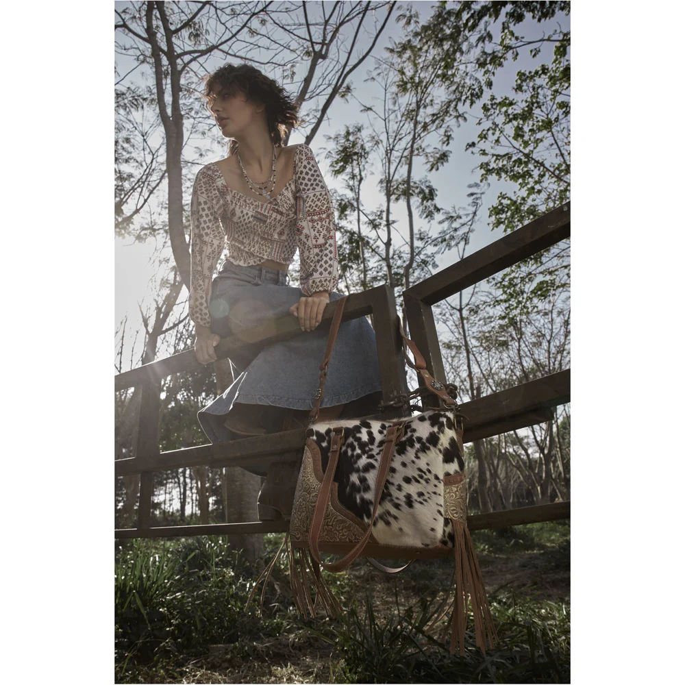 9110-myra-laredo-concealed-carry-bag-hand-stitched-hair-on-leather-satchel-with-embossed-detailing-and-western-fringe-design-1.webp
