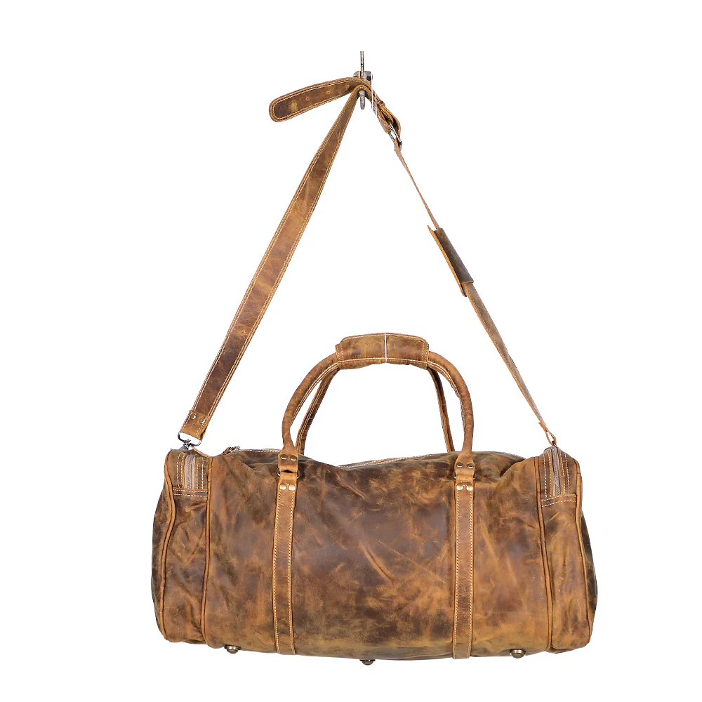 9221-myra-soulful-leather-traveller-bag-cowgirl-inspired-duffle-bag-with-buckled-pocket-and-sturdy-handles-for-rustic-getaways-1.webp