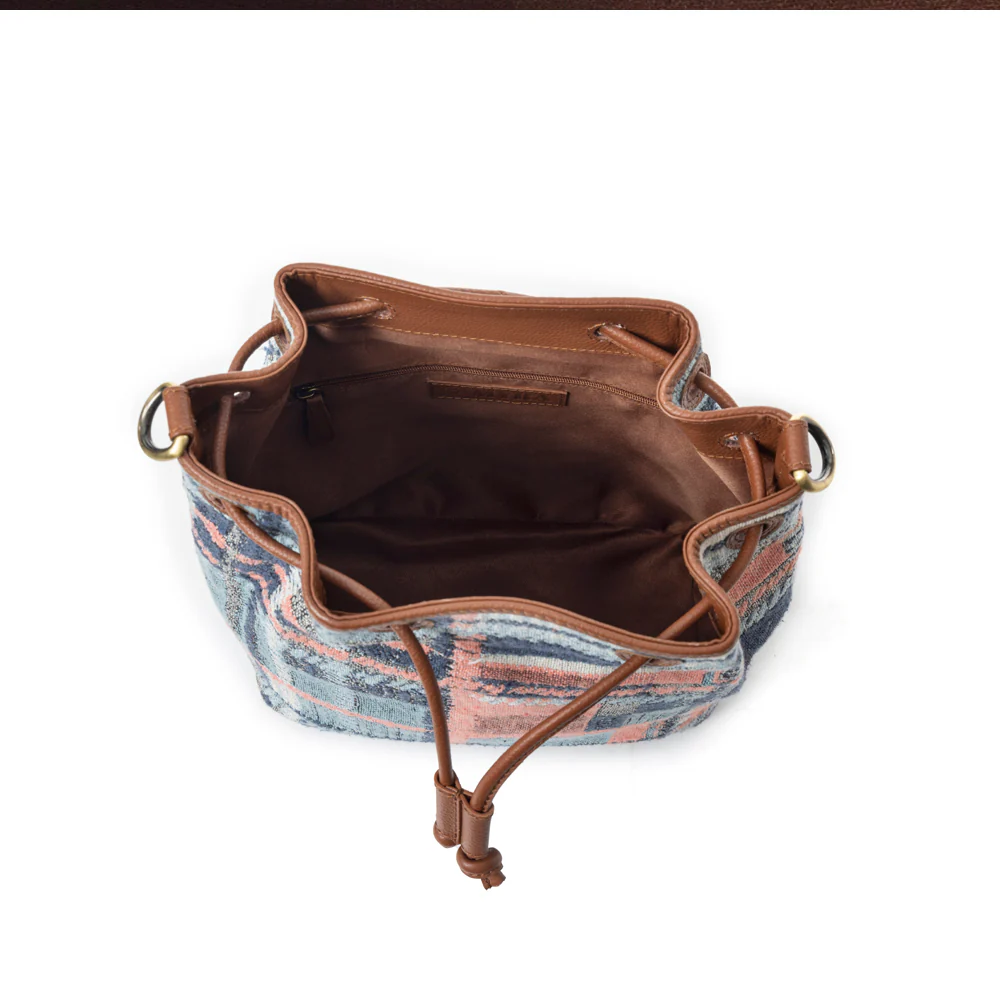 9854-pastel-desert-sunrise-bucket-bag-in-blue-1.webp